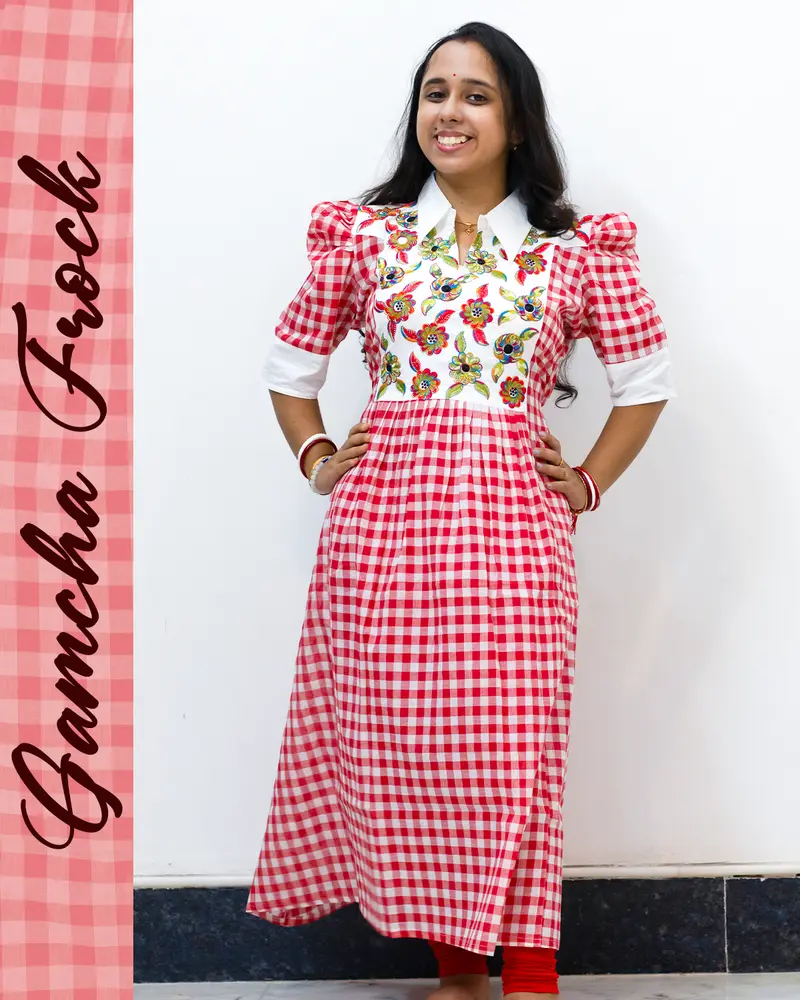 Gamcha frock with floral embroidery and puffed sleeves
