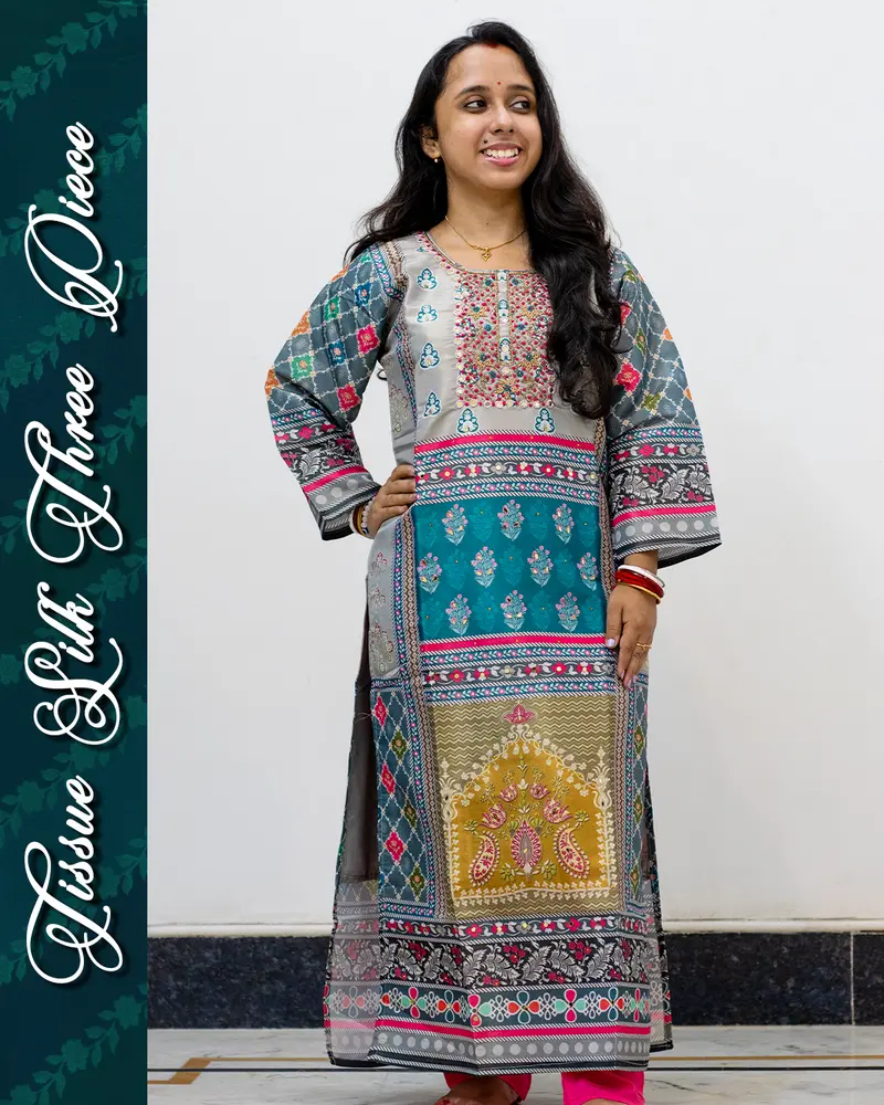 Model wearing Tissue Silk Three Piece Set with mirror work and dupatta