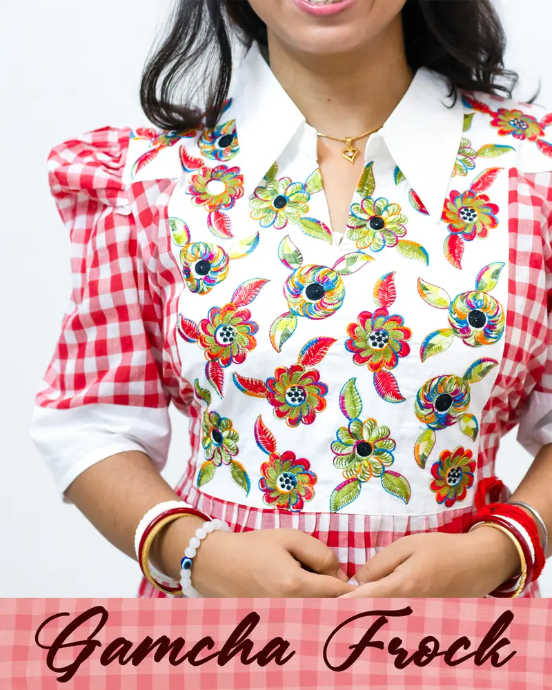 Gamcha frock with floral embroidery and puffed sleeves