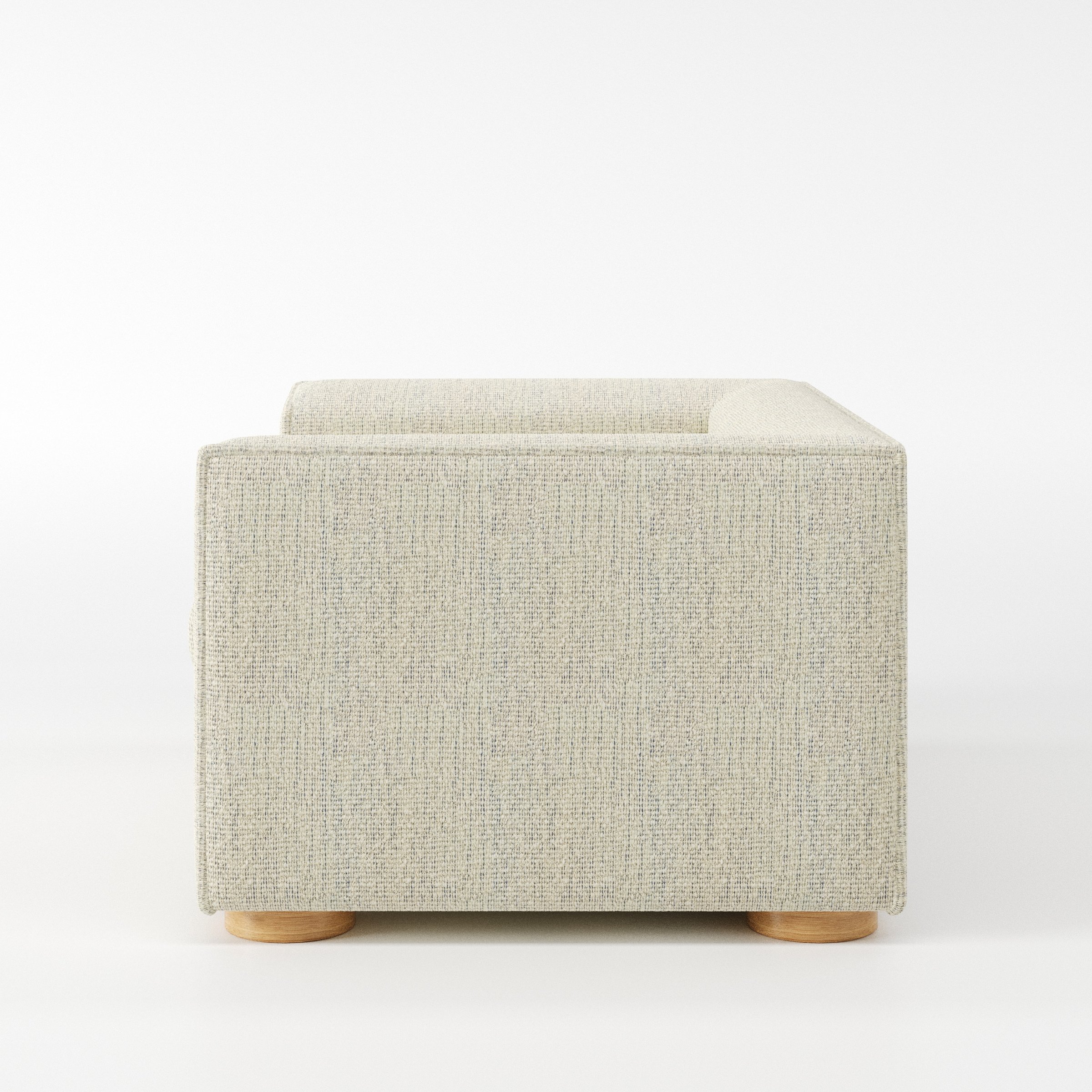 Feale armchair in Orsay Boucle Cream and Marine shown in side profile displaying proportions and overall silhouette.