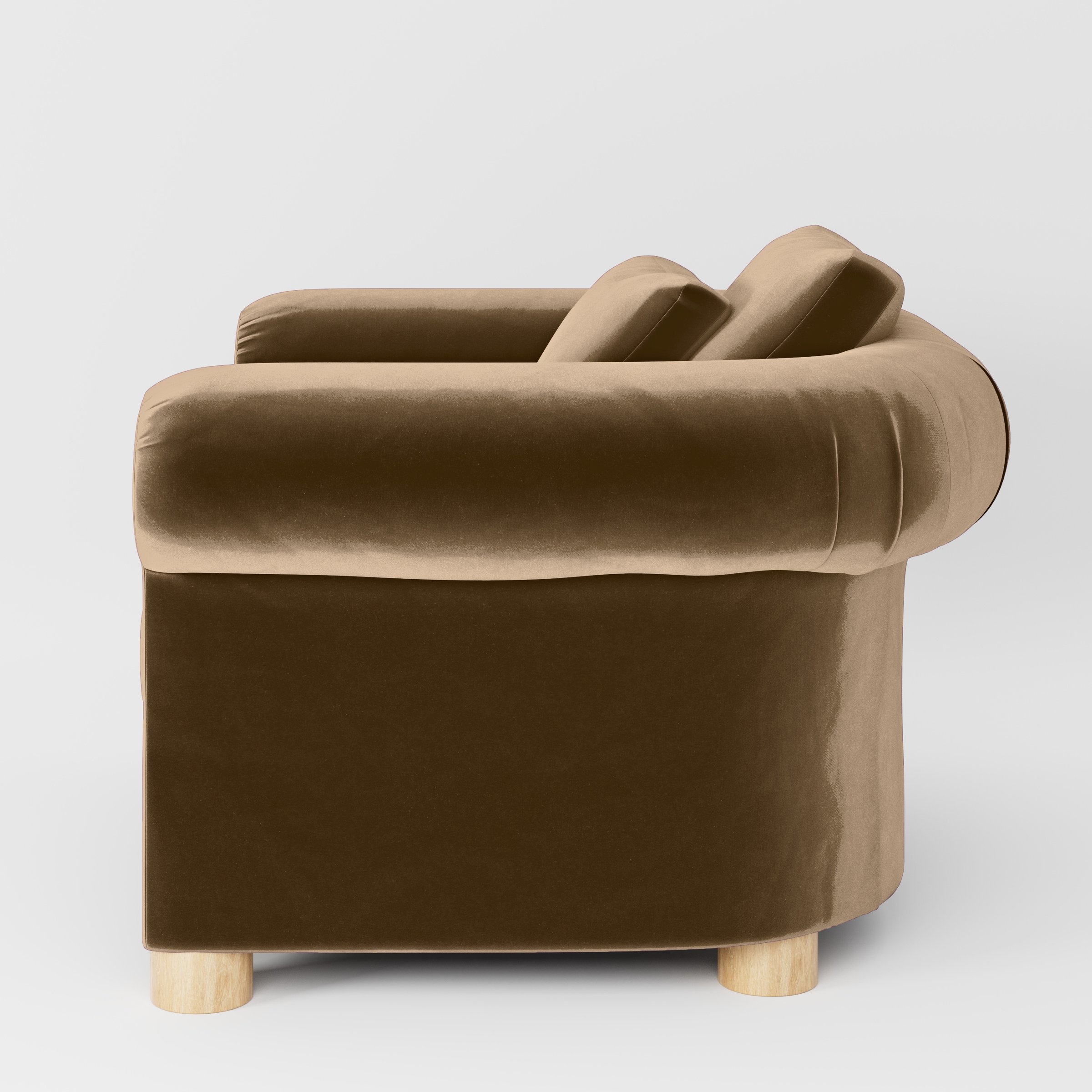 Side view of the Windermere armchair upholstered in Plush EasyClean Velvet in Caribou.
