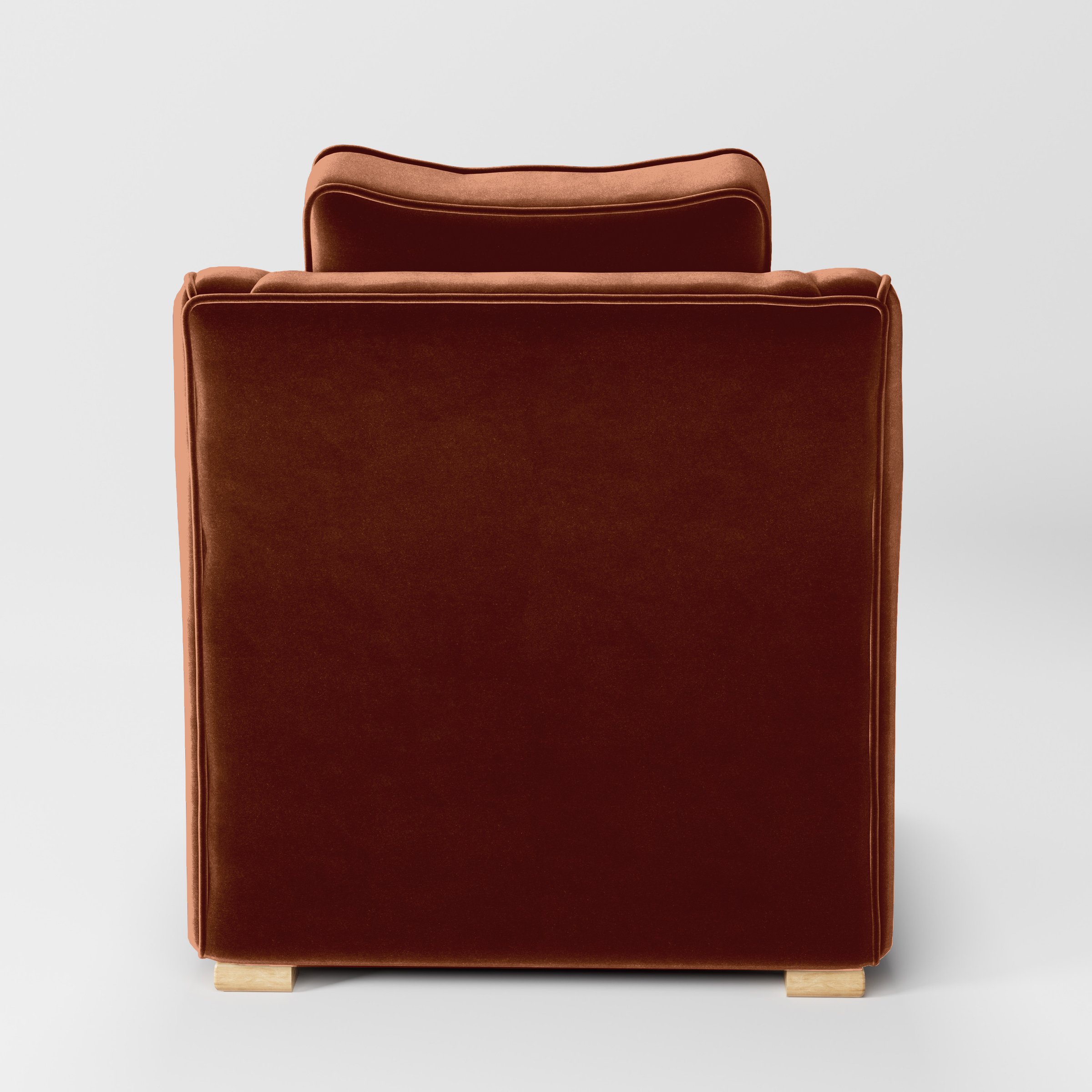 Rear view of the Cashel armchair upholstered in Plush EasyClean Velvet in Apricot.