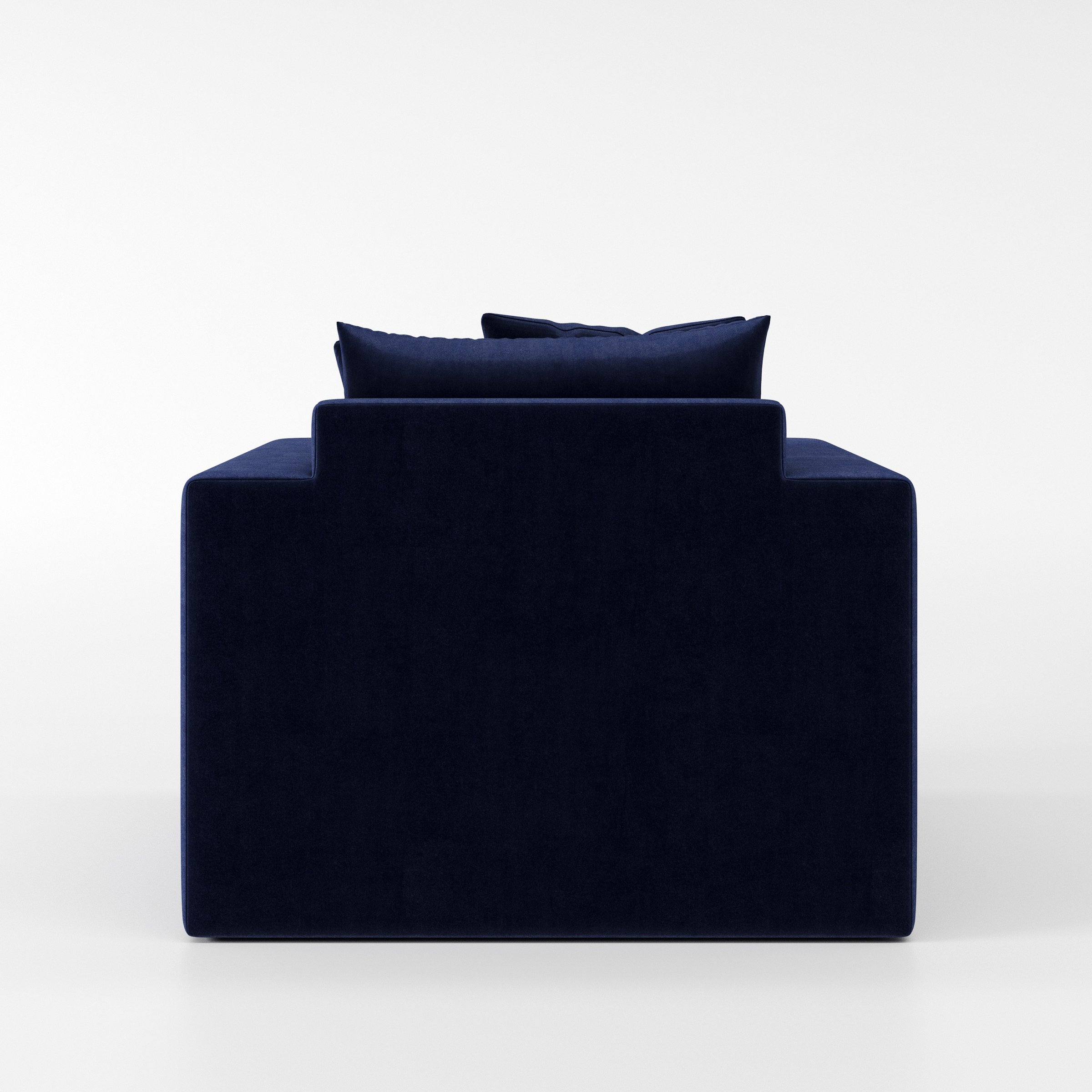 Coniston armchair in Noss Velvet Navy shown from the rear highlighting backrest shape and upholstery finish.
