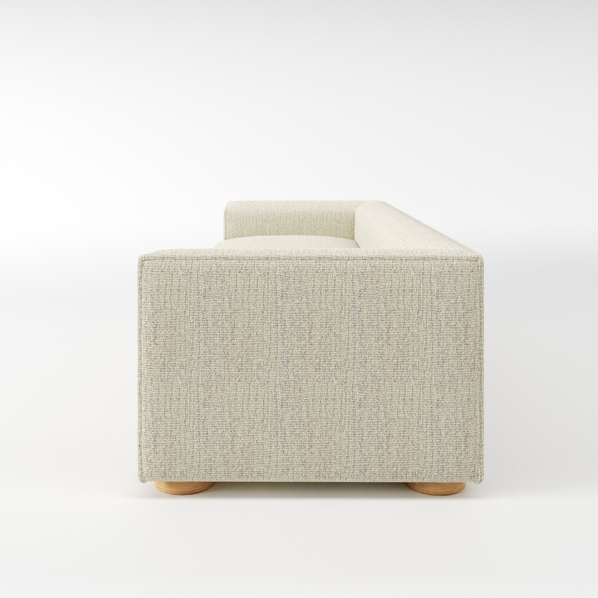 Feale sofa in Orsay Boucle Cream and Marine shown in side profile displaying proportions and overall silhouette.
