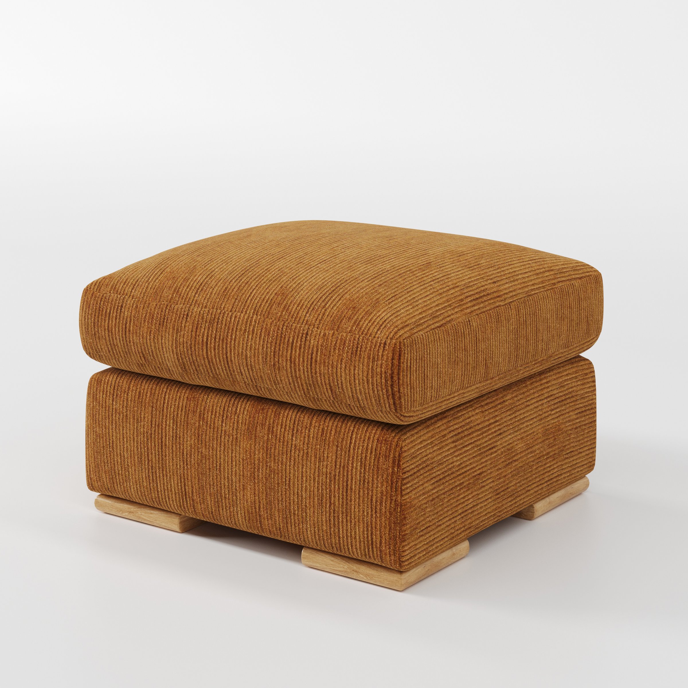 Moy footstool in Caldey Velvet Corduroy Tobacco shown at a diagonal angle highlighting deep cushioning and low wooden base.
