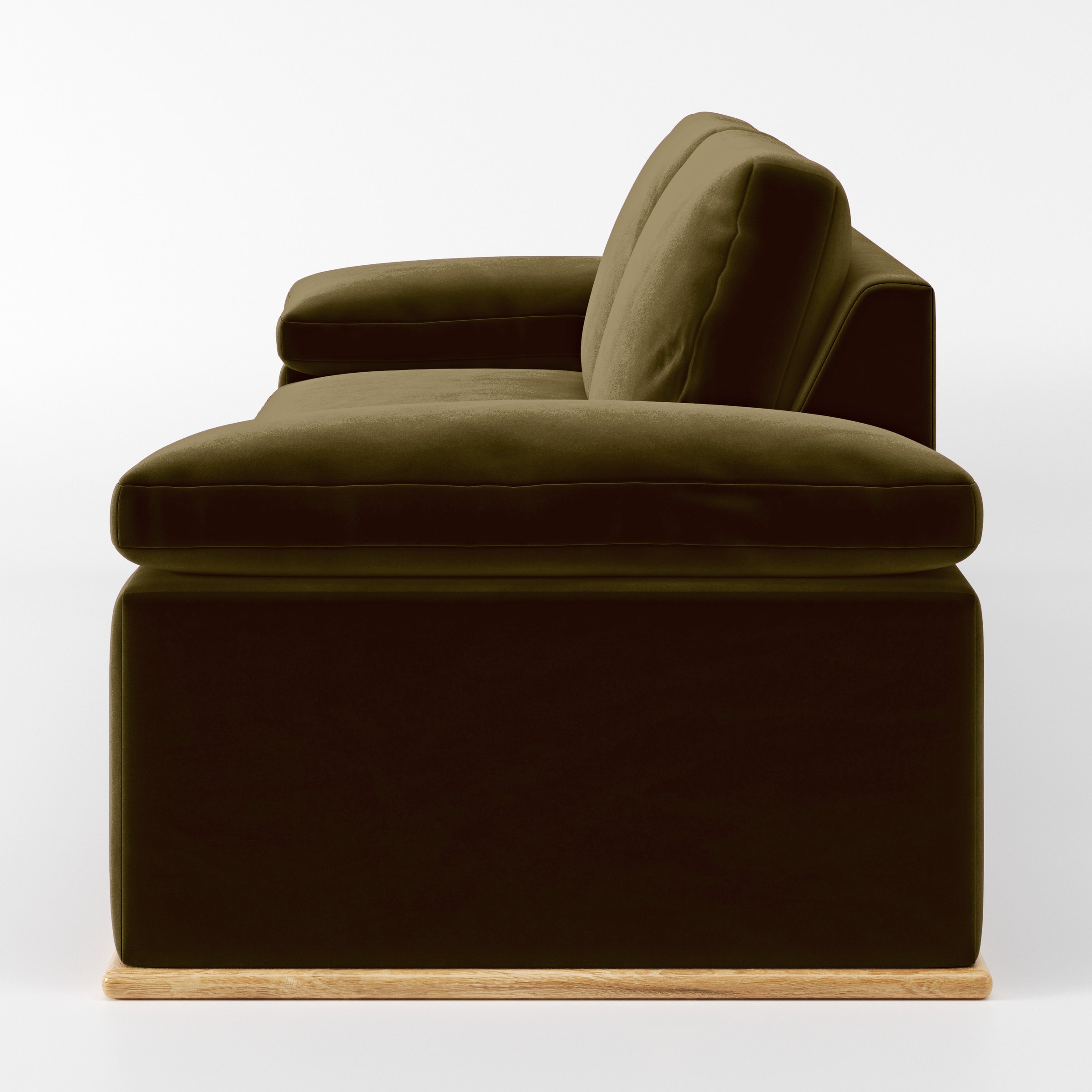 Side view of the Cusher sofa upholstered in Plush EasyClean Velvet in Cedar.