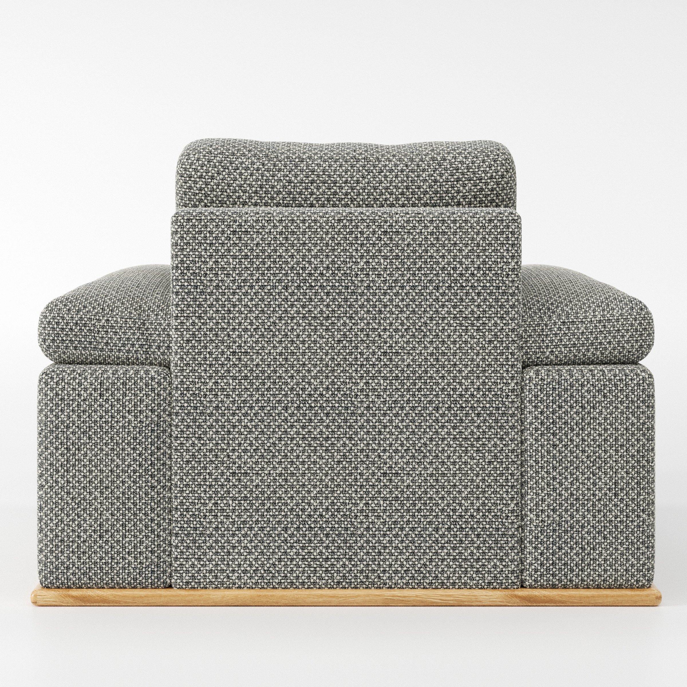 Cusher armchair in Rousay Wool Blend Tar and Chalk shown from the rear highlighting backrest shape and upholstery finish.