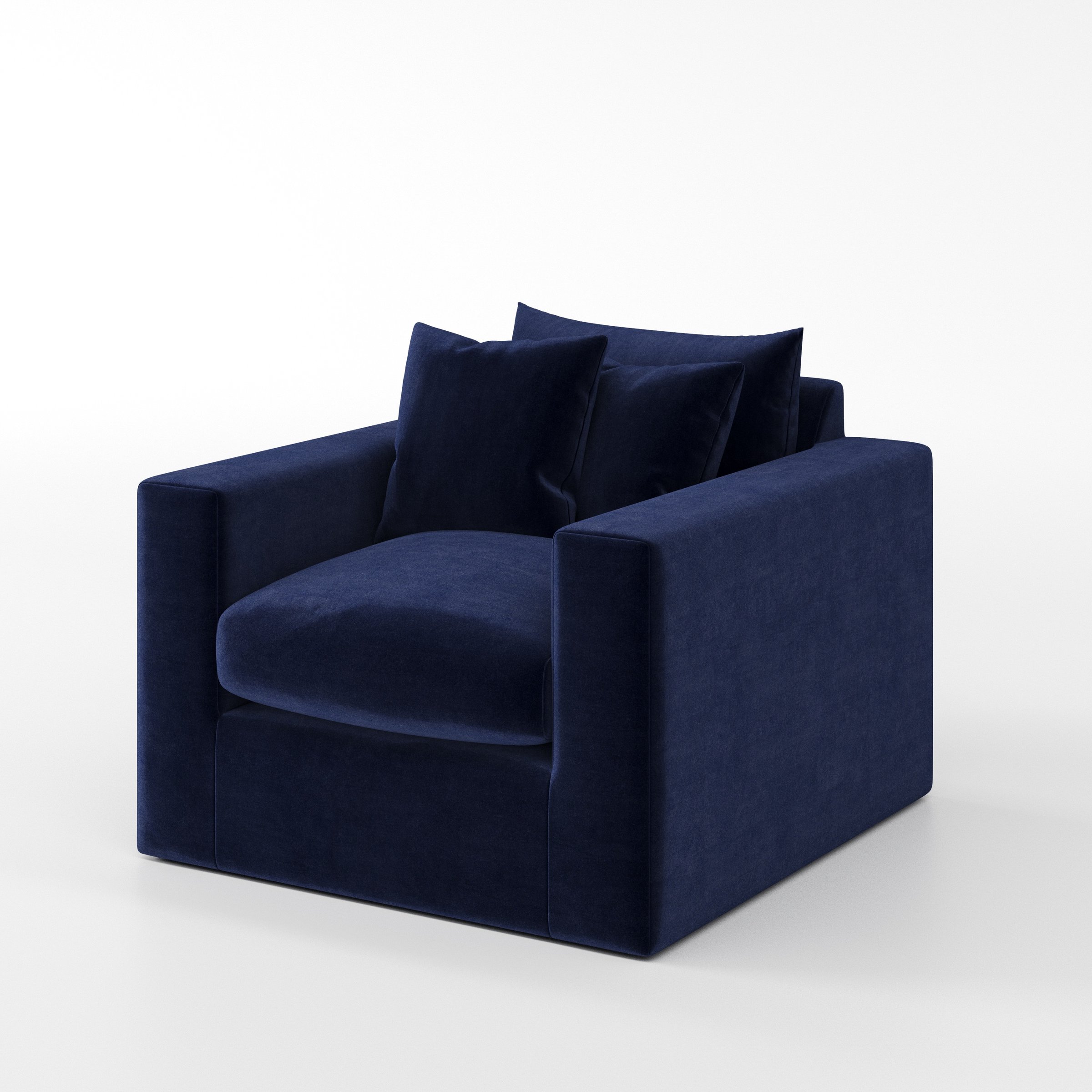 Coniston armchair in Noss Velvet Navy shown at a diagonal angle highlighting arms and seat depth.