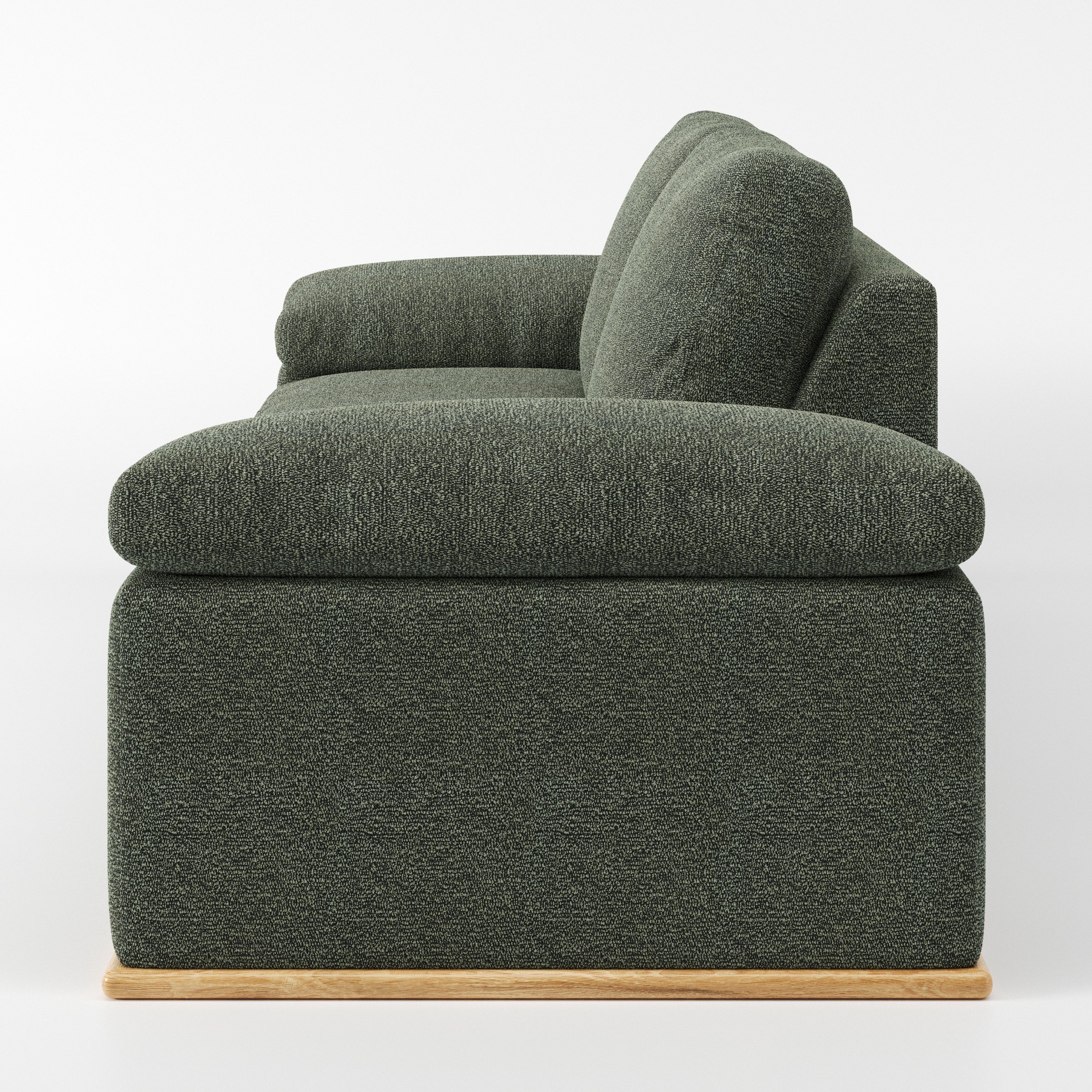 Cusher sofa in Kilda Boucle Moss shown in side profile displaying proportions and overall silhouette.
