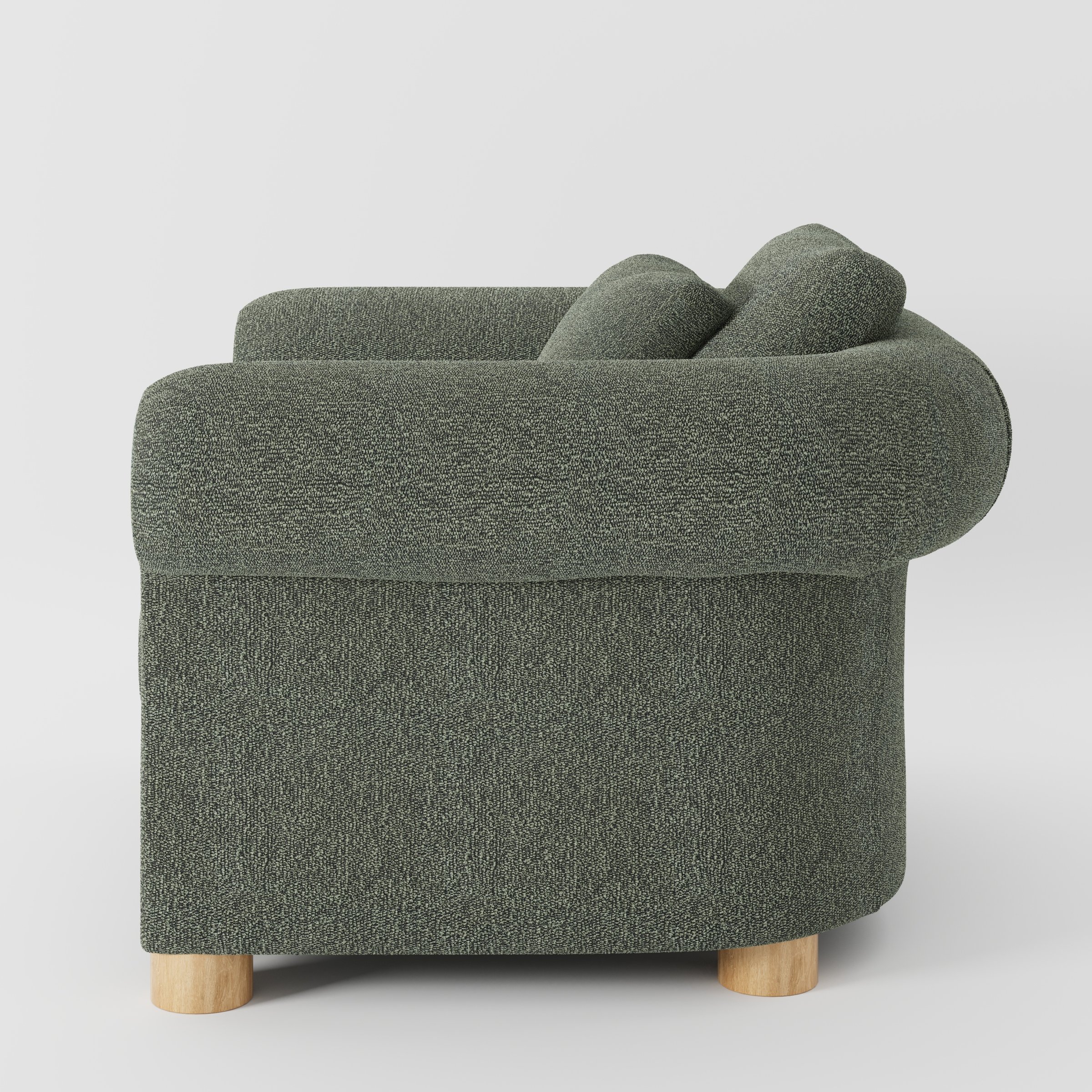 Windermere armchair in Kilda Boucle Moss shown in side profile displaying proportions and overall silhouette.