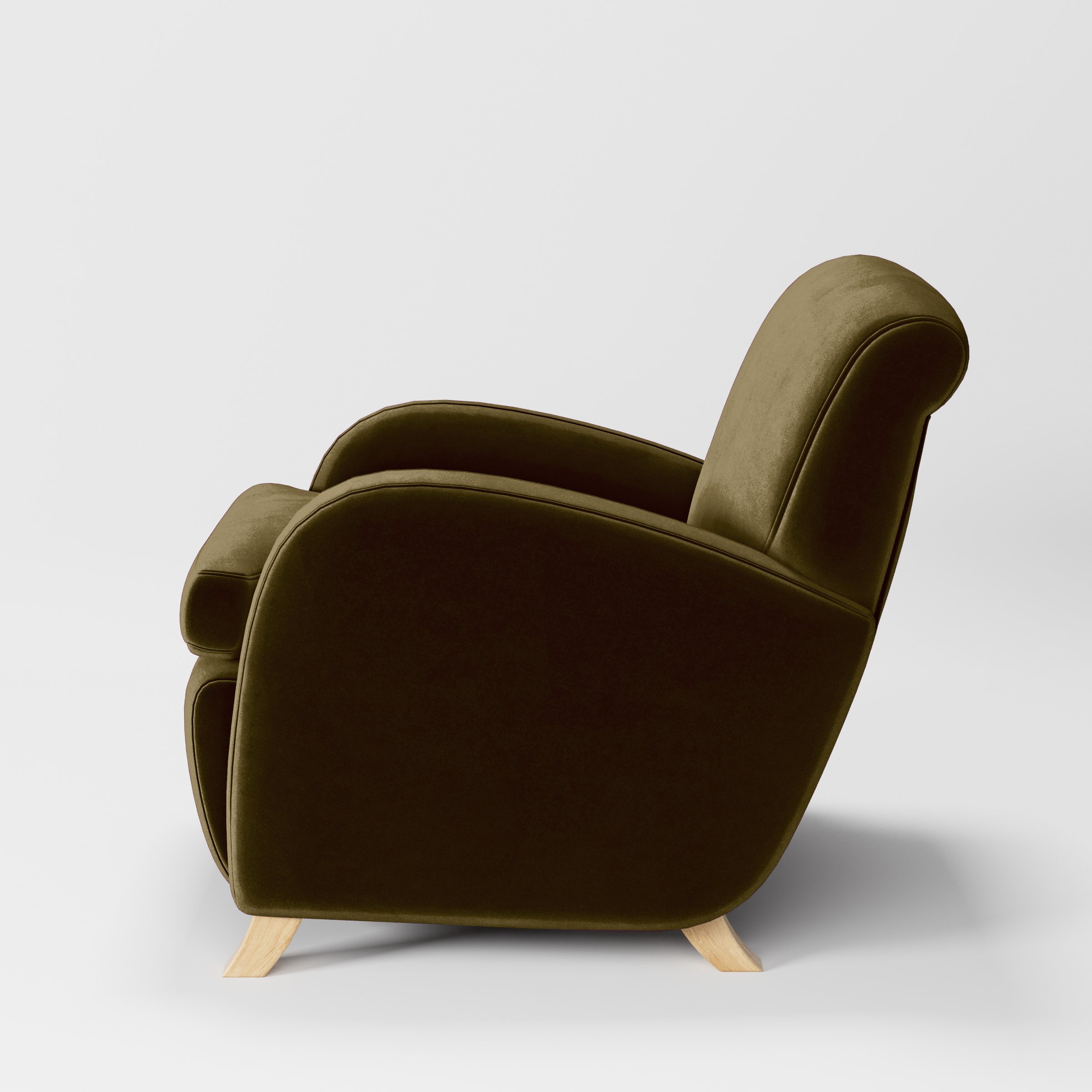Side view of the Rye armchair upholstered in Plush EasyClean Velvet in Cedar.