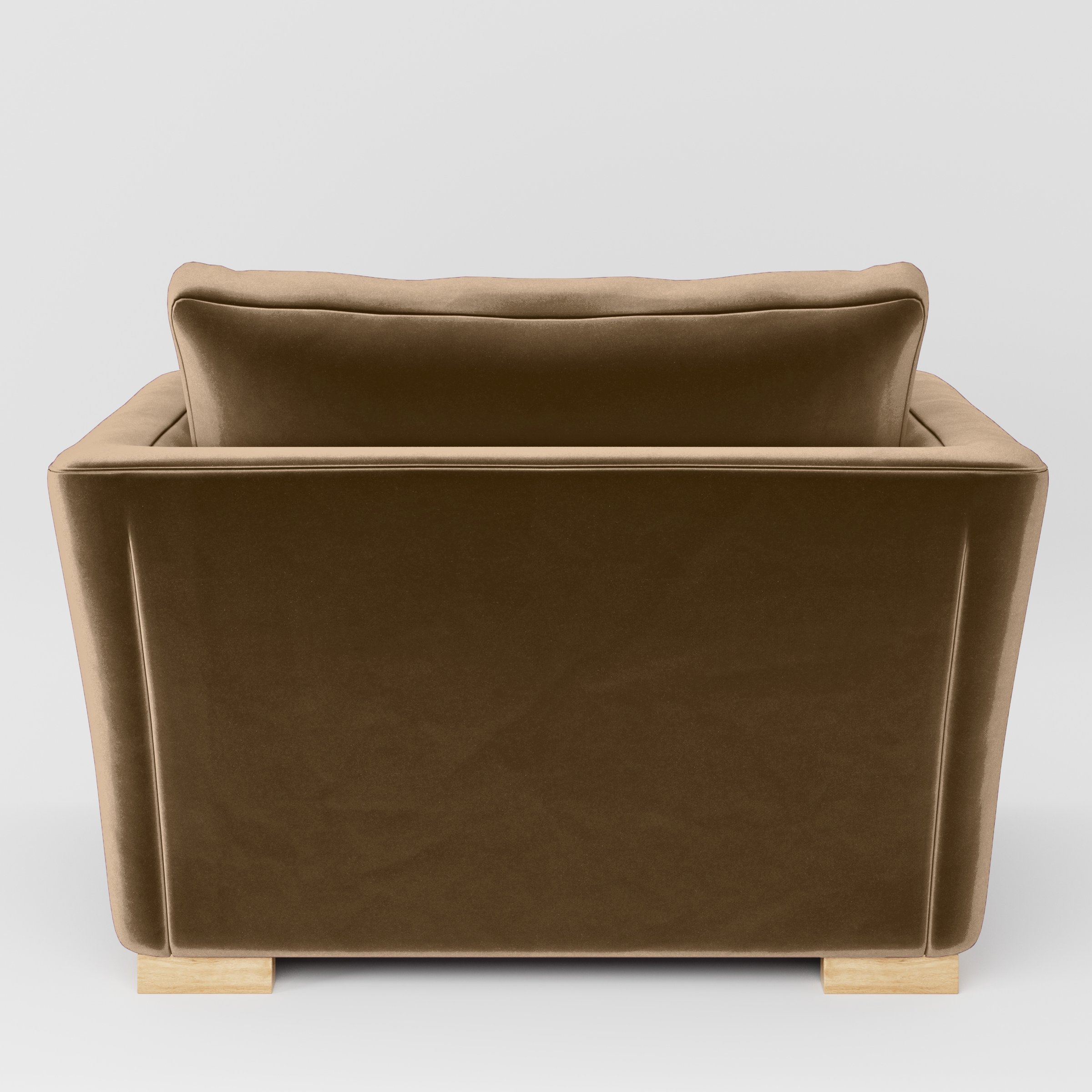 Rear view of the Stowe armchair upholstered in Plush EasyClean Velvet in Caribou.