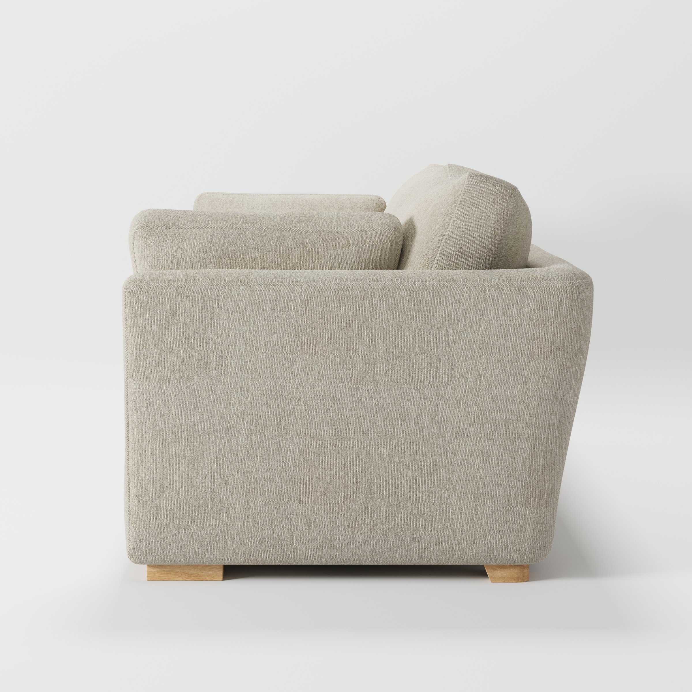 Stowe sofa in Alderney Linen Oatmeal shown in side profile displaying proportions and overall silhouette.