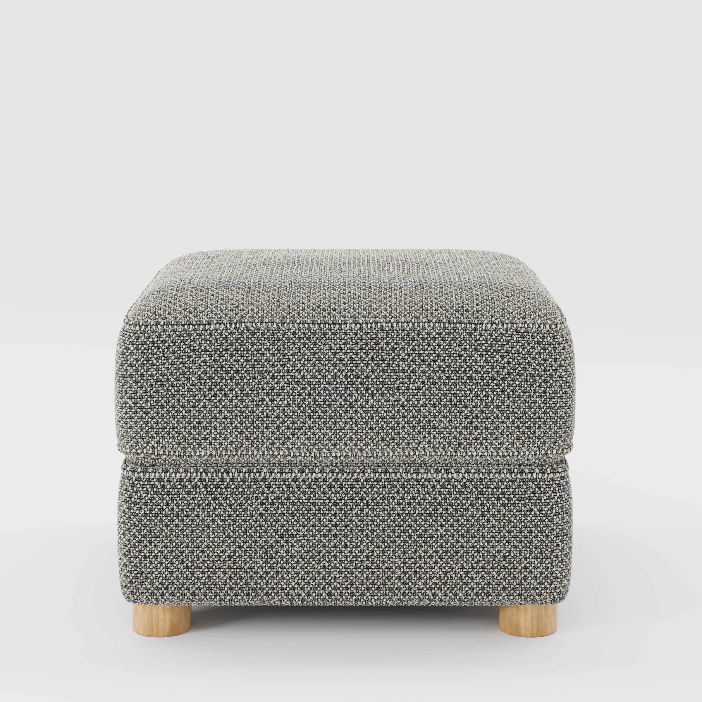 Fergus footstool in Rousay Wool Blend Tar and Chalk shown front-on against a neutral studio backdrop.