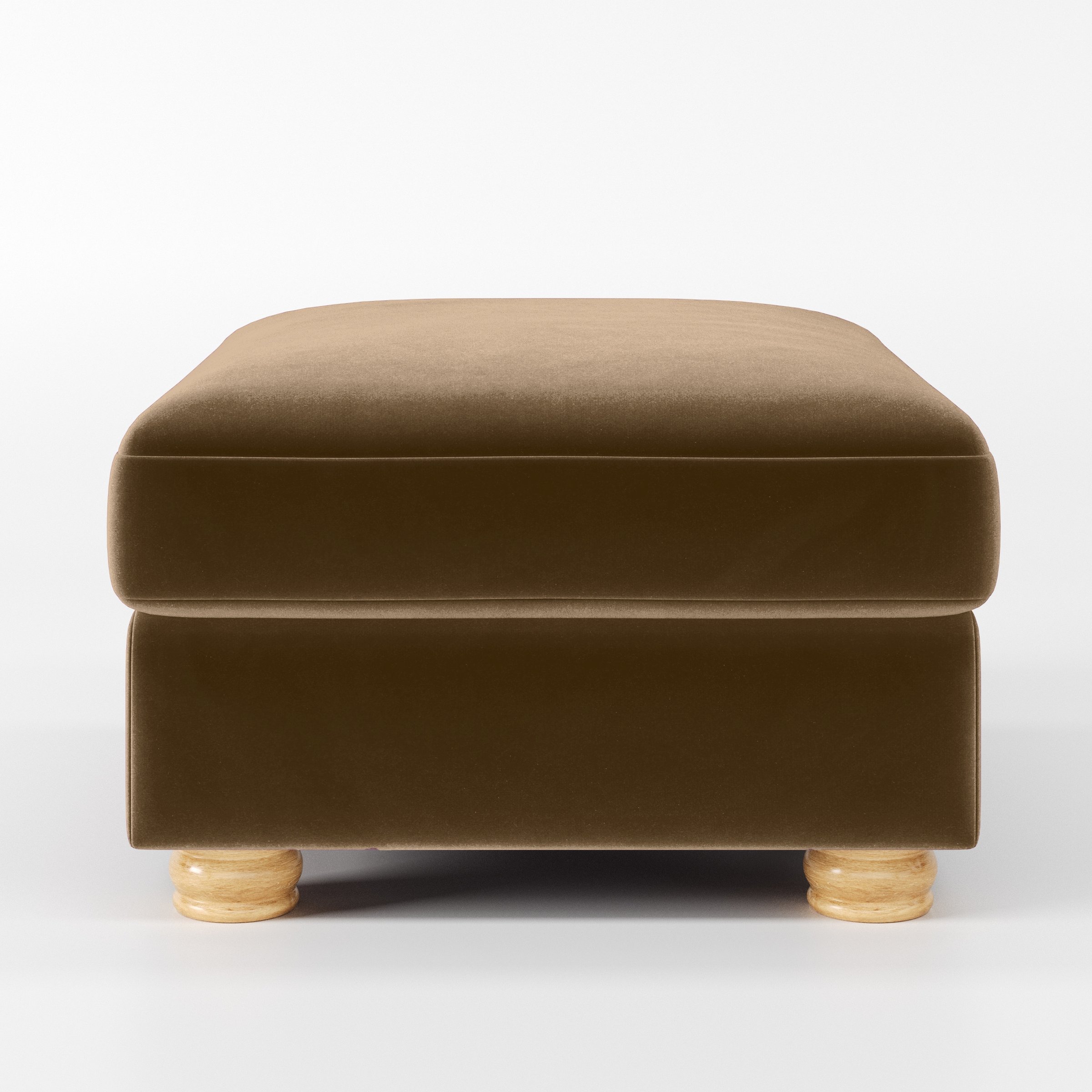 Front view of the Anna Lee footstool upholstered in Plush EasyClean Velvet in Caribou.