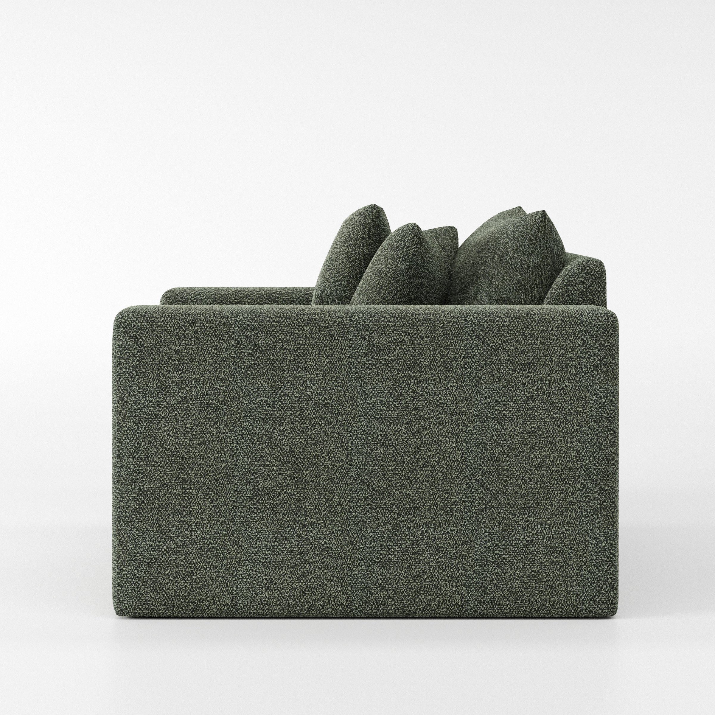 Coniston armchair in Kilda Boucle Moss shown in side profile displaying proportions and overall silhouette.
