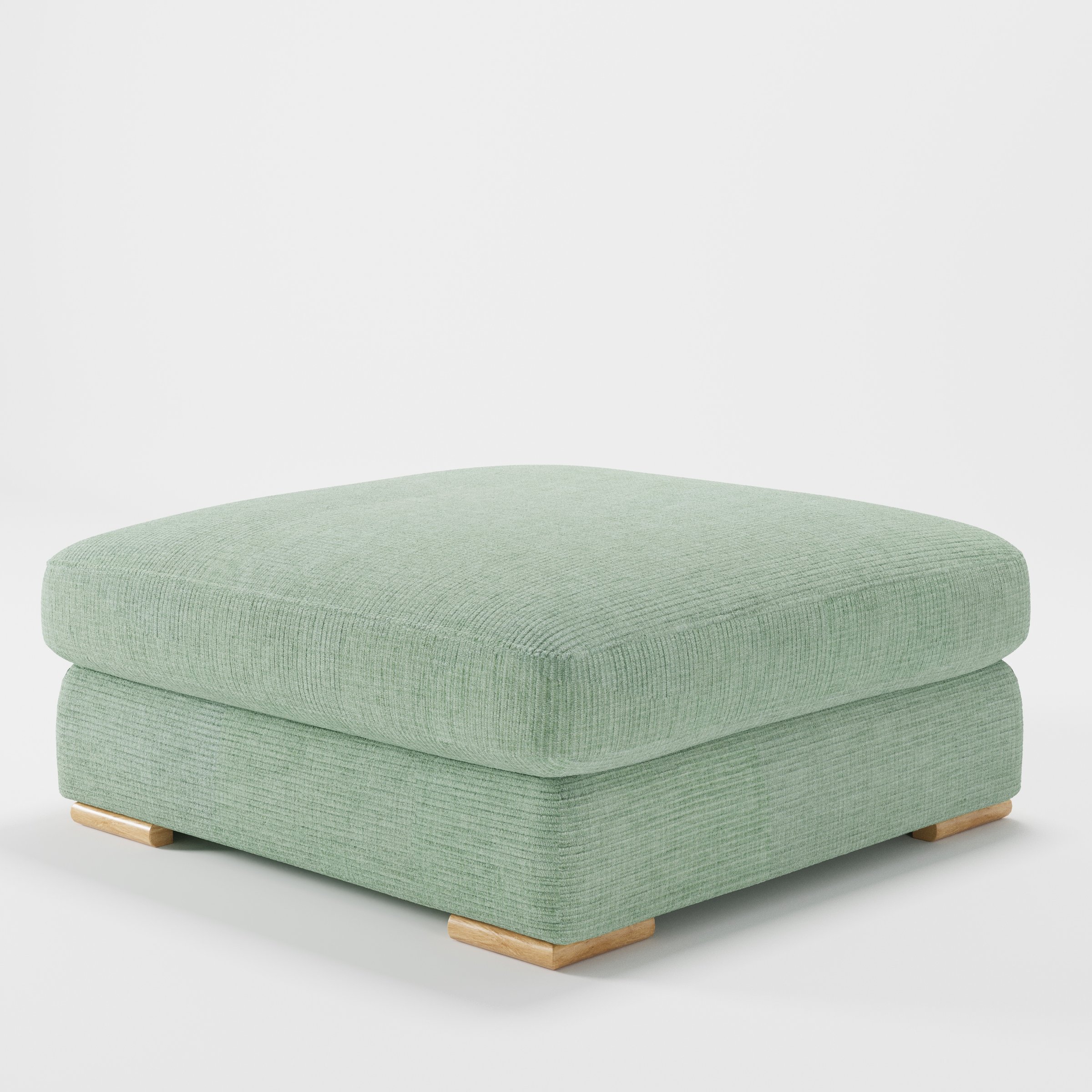 Olton footstool in Caldey Velvet Corduroy Eucalyptus shown at a diagonal angle highlighting low profile and inset wooden base.