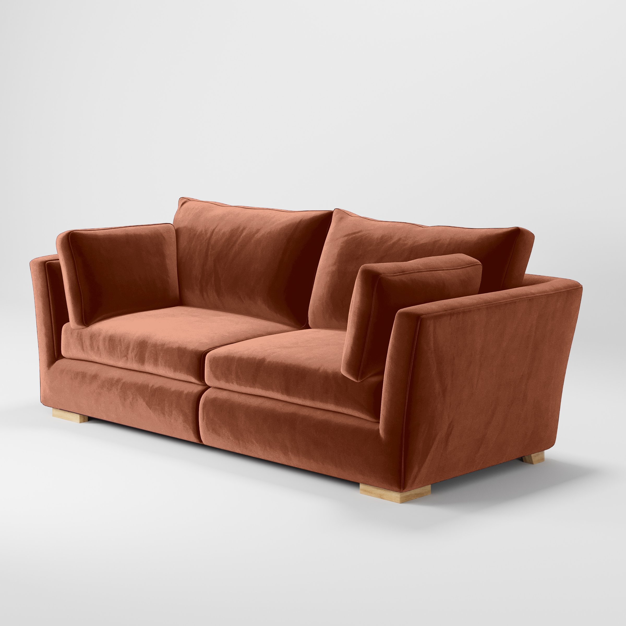 Diagonal view of the Stowe sofa upholstered in Plush EasyClean Velvet in Apricot.