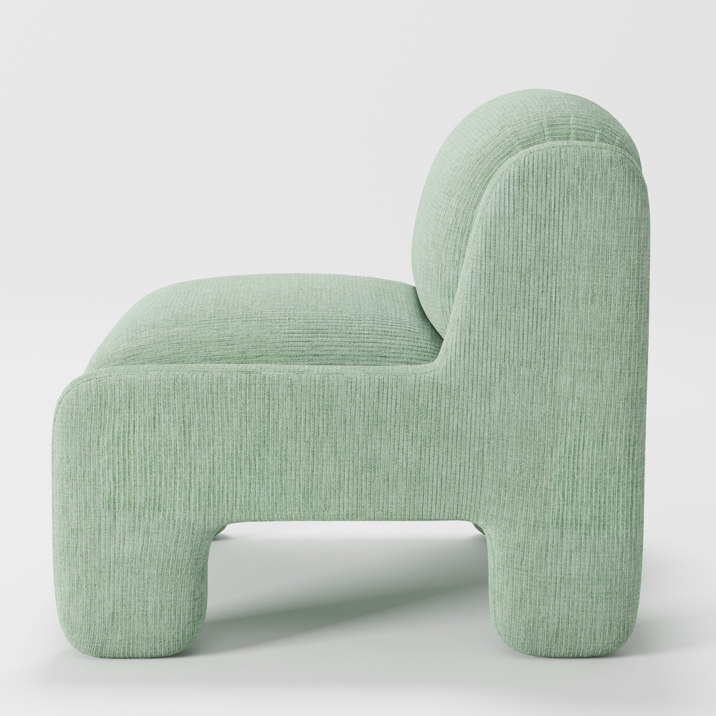Inny armchair in Caldey Velvet Corduroy Eucalyptus shown in side profile displaying proportions and overall silhouette.