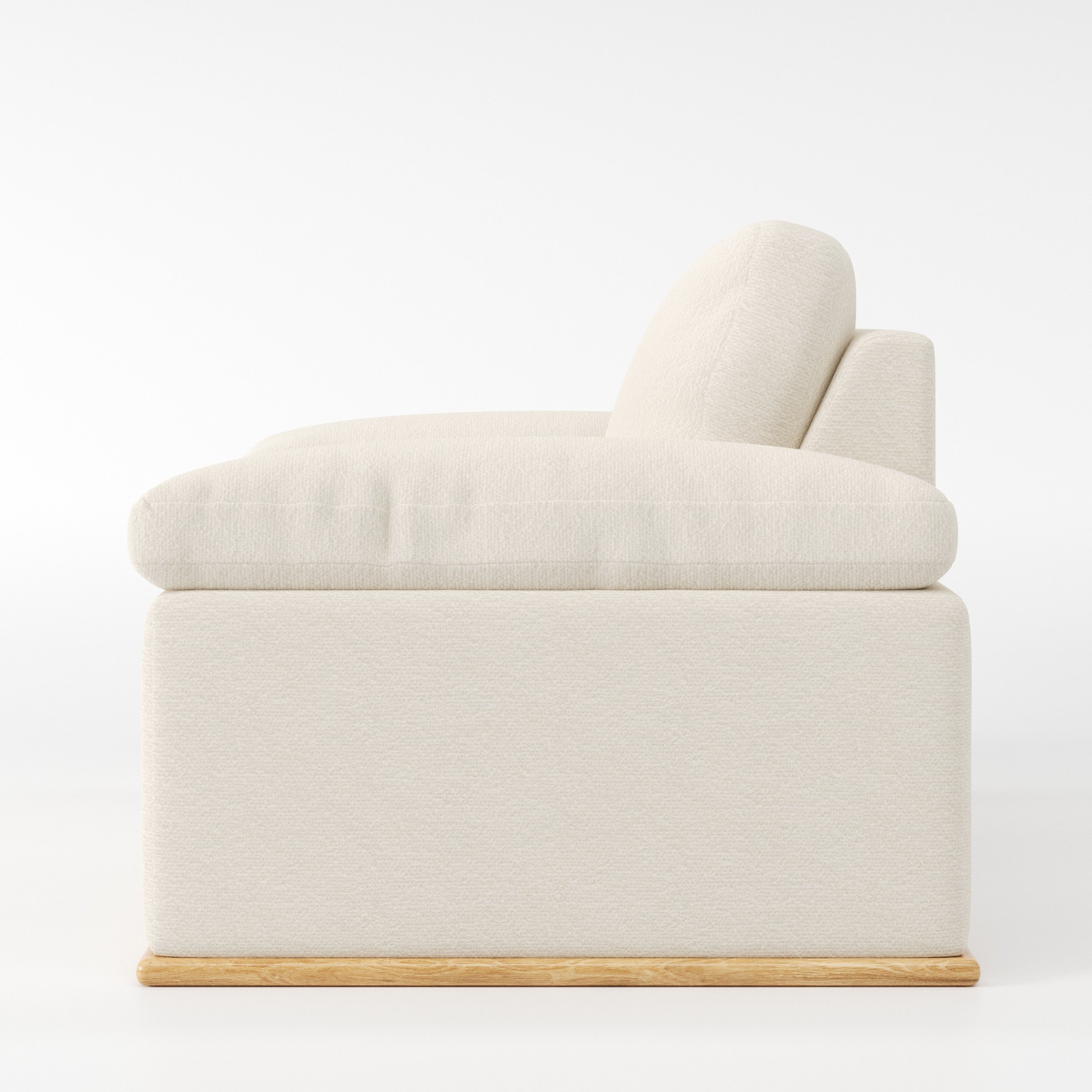 Cusher armchair in Kilda Boucle Cream shown in side profile displaying proportions and overall silhouette.
