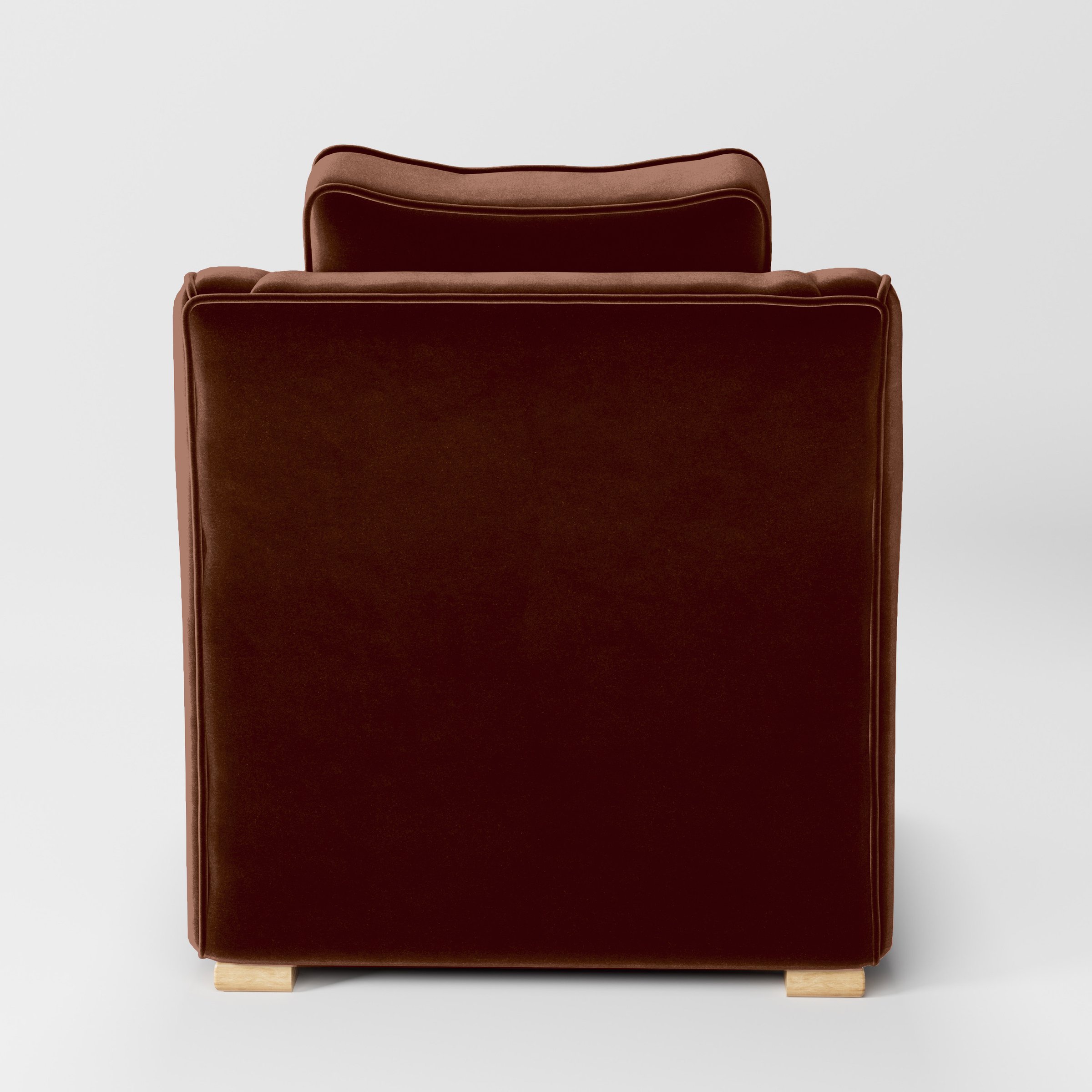 Rear view of the Cashel armchair upholstered in Plush EasyClean Velvet in Maple.