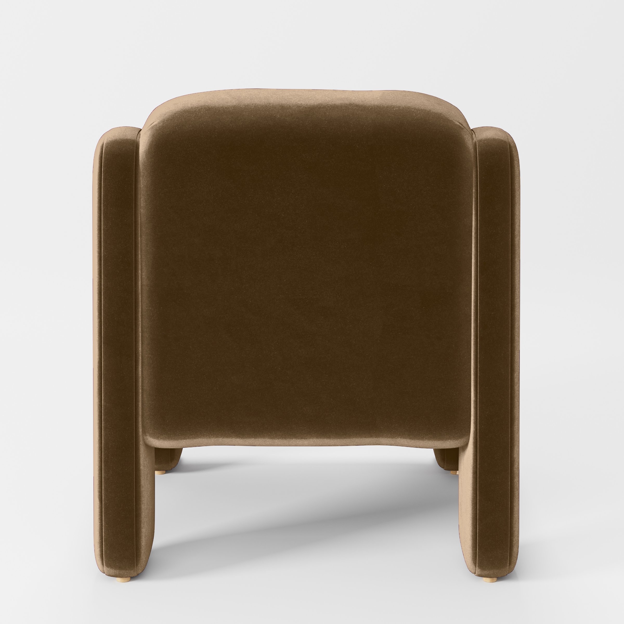 Rear view of the Inny armchair upholstered in Plush EasyClean Velvet in Caribou.
