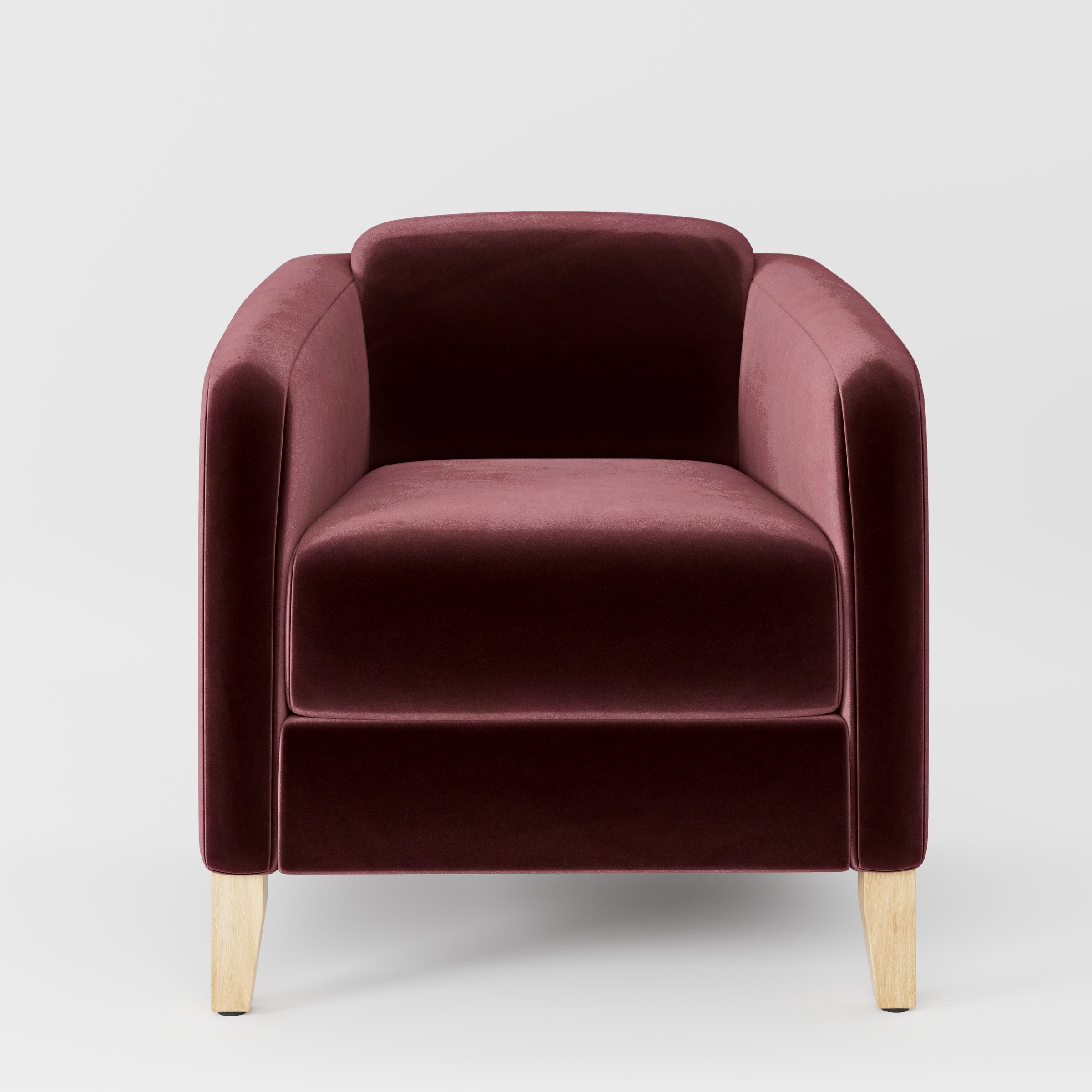 Front view of the Erne armchair upholstered in Plush EasyClean Velvet in Ruby.