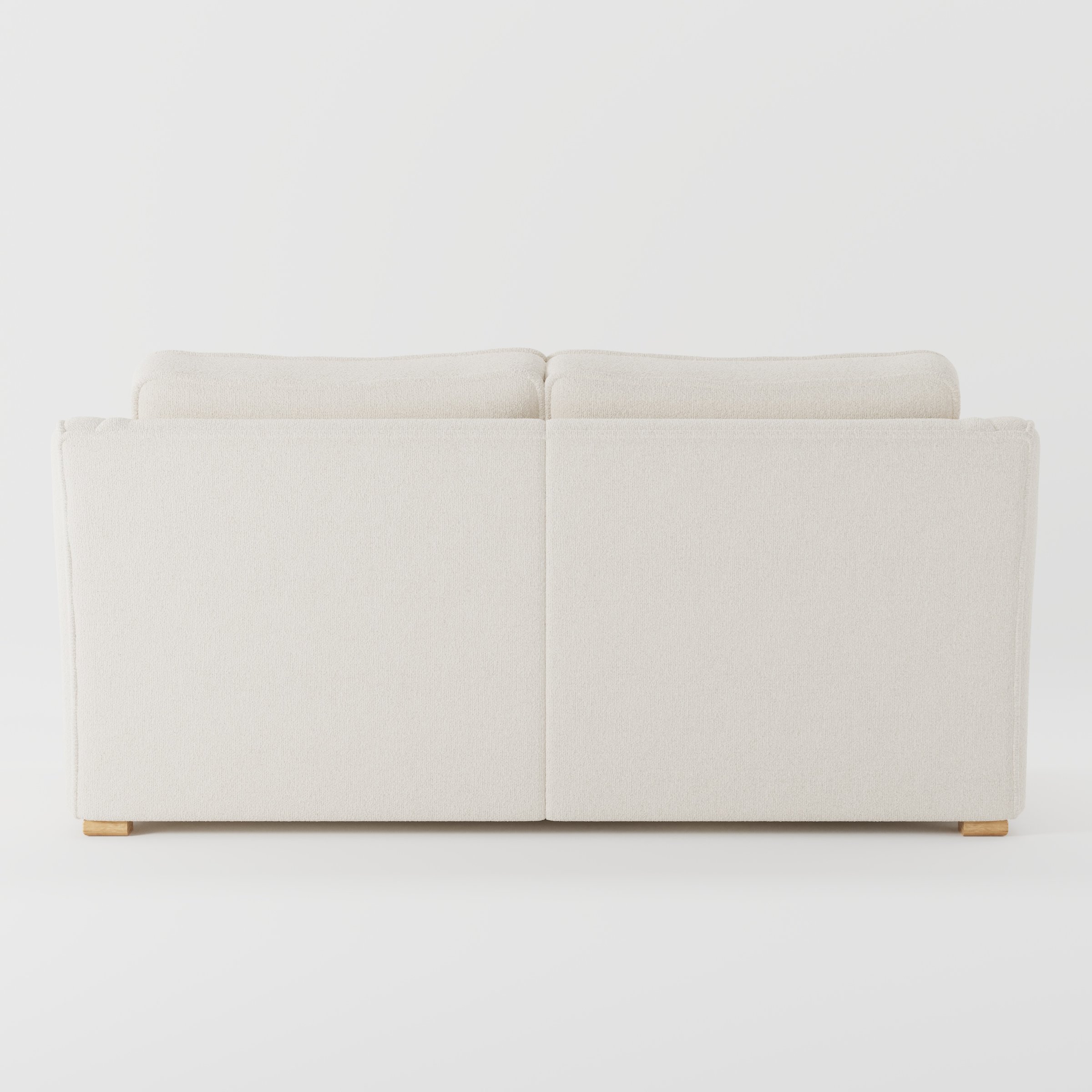 Cashel sofa in Kilda Boucle Cream shown from the rear highlighting back cushions and upholstery finish.