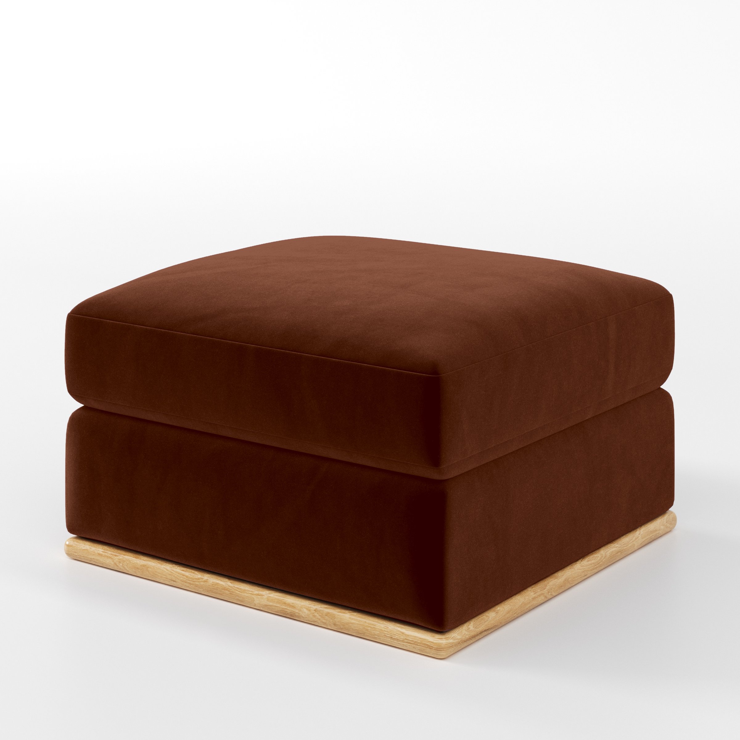 Diagonal view of the Cusher footstool upholstered in Plush EasyClean Velvet in Maple.