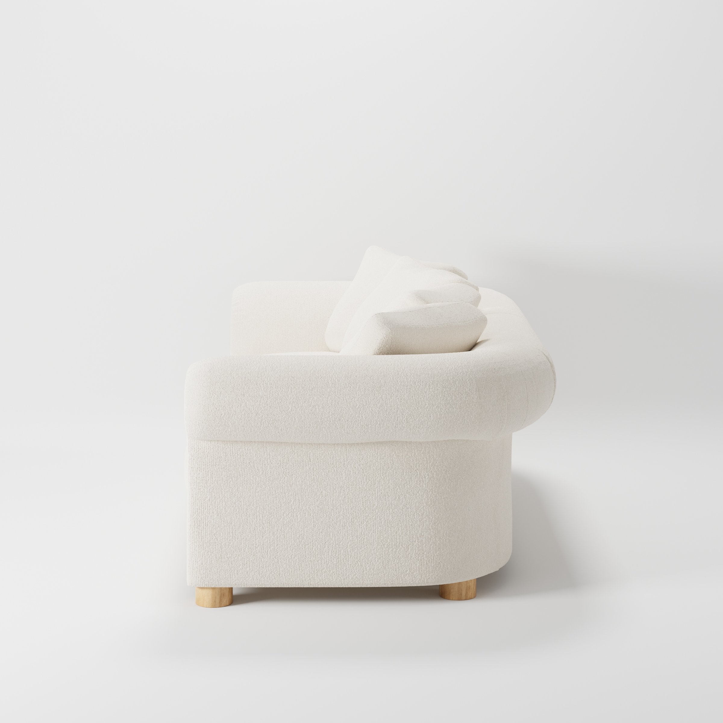 Windermere sofa in Kilda Boucle Cream shown in side profile displaying proportions and overall silhouette.