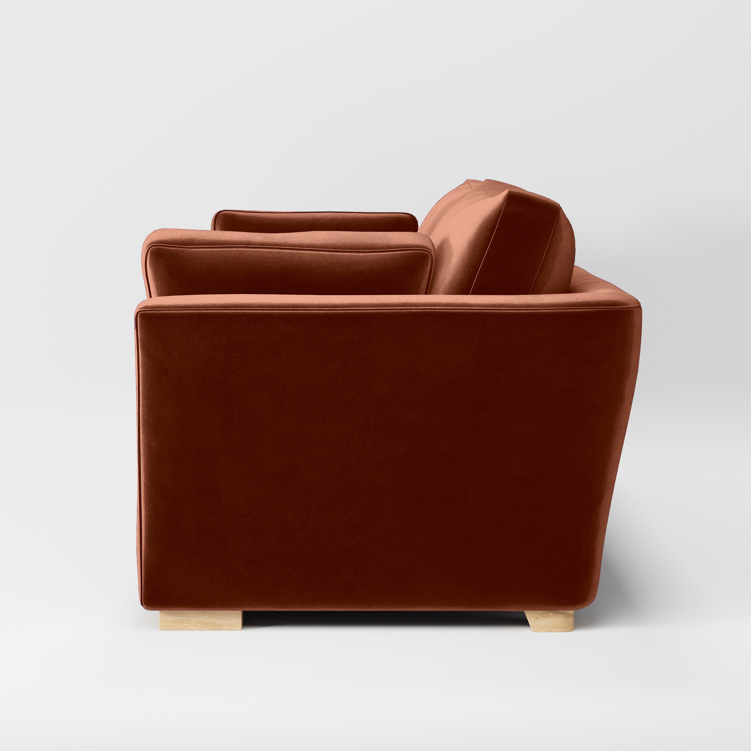 Side view of the Stowe sofa upholstered in Plush EasyClean Velvet in Apricot.