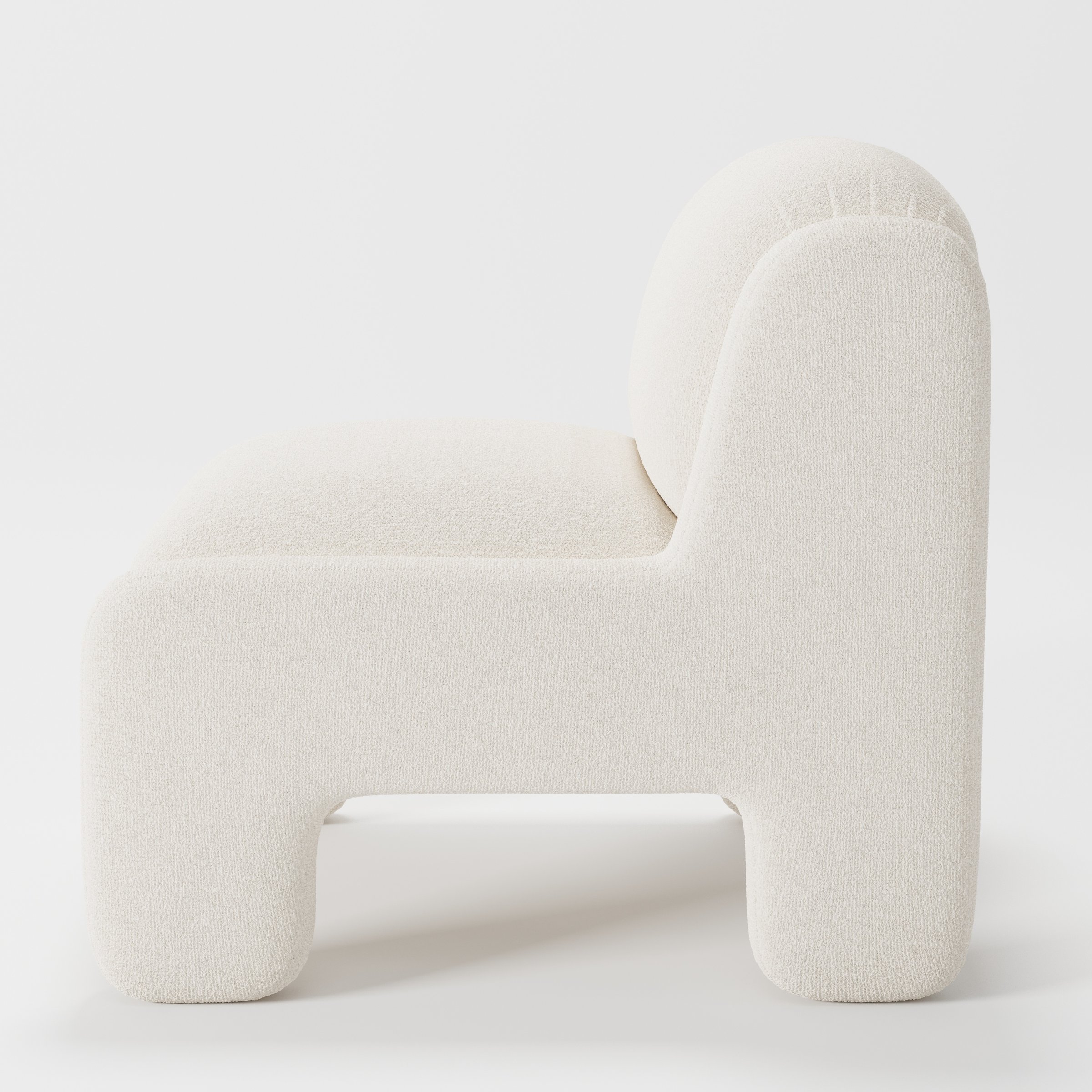 Inny armchair in Kilda Boucle Cream shown in side profile displaying proportions and overall silhouette.