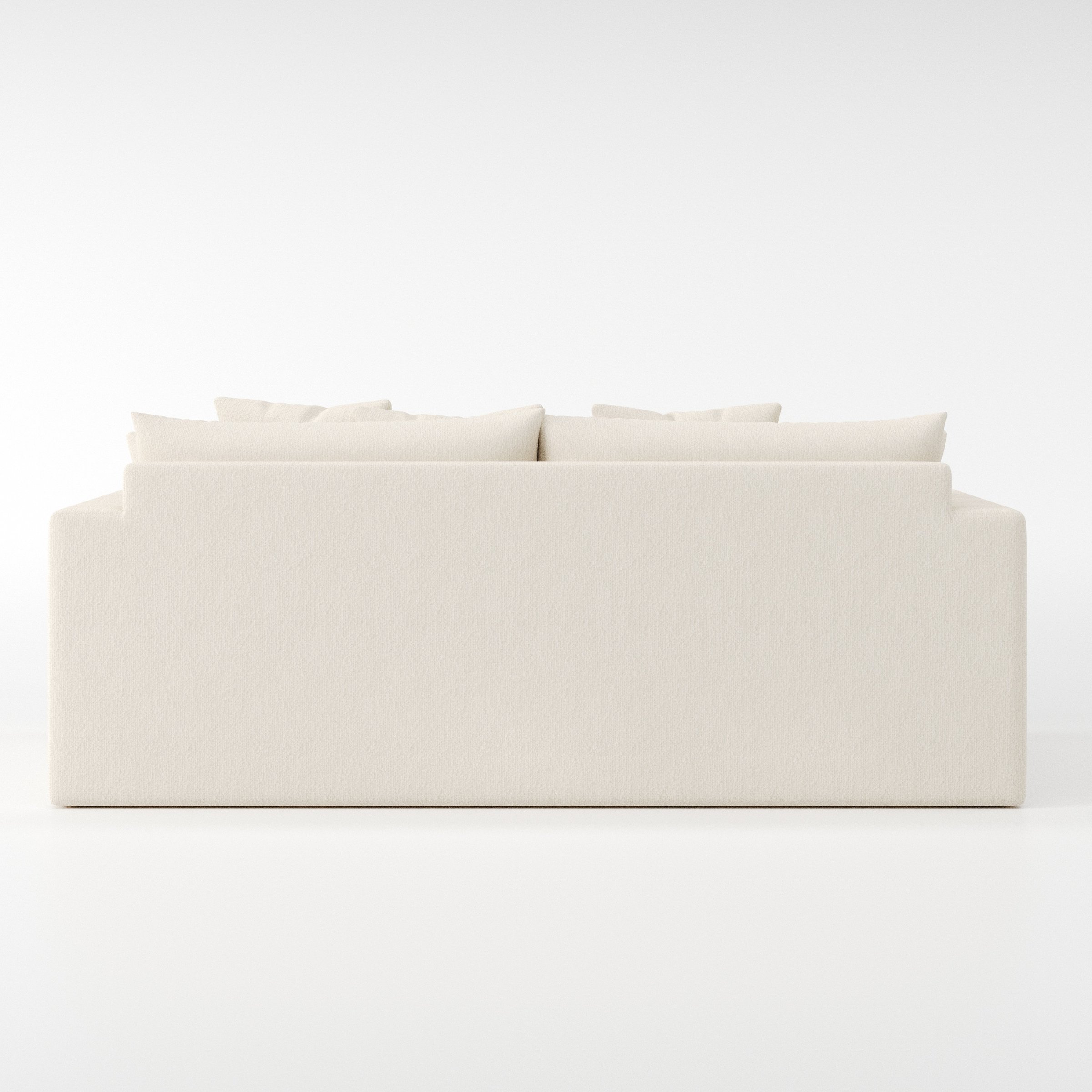Coniston sofa in Kilda Boucle Cream shown from the rear highlighting back cushions and upholstery finish.