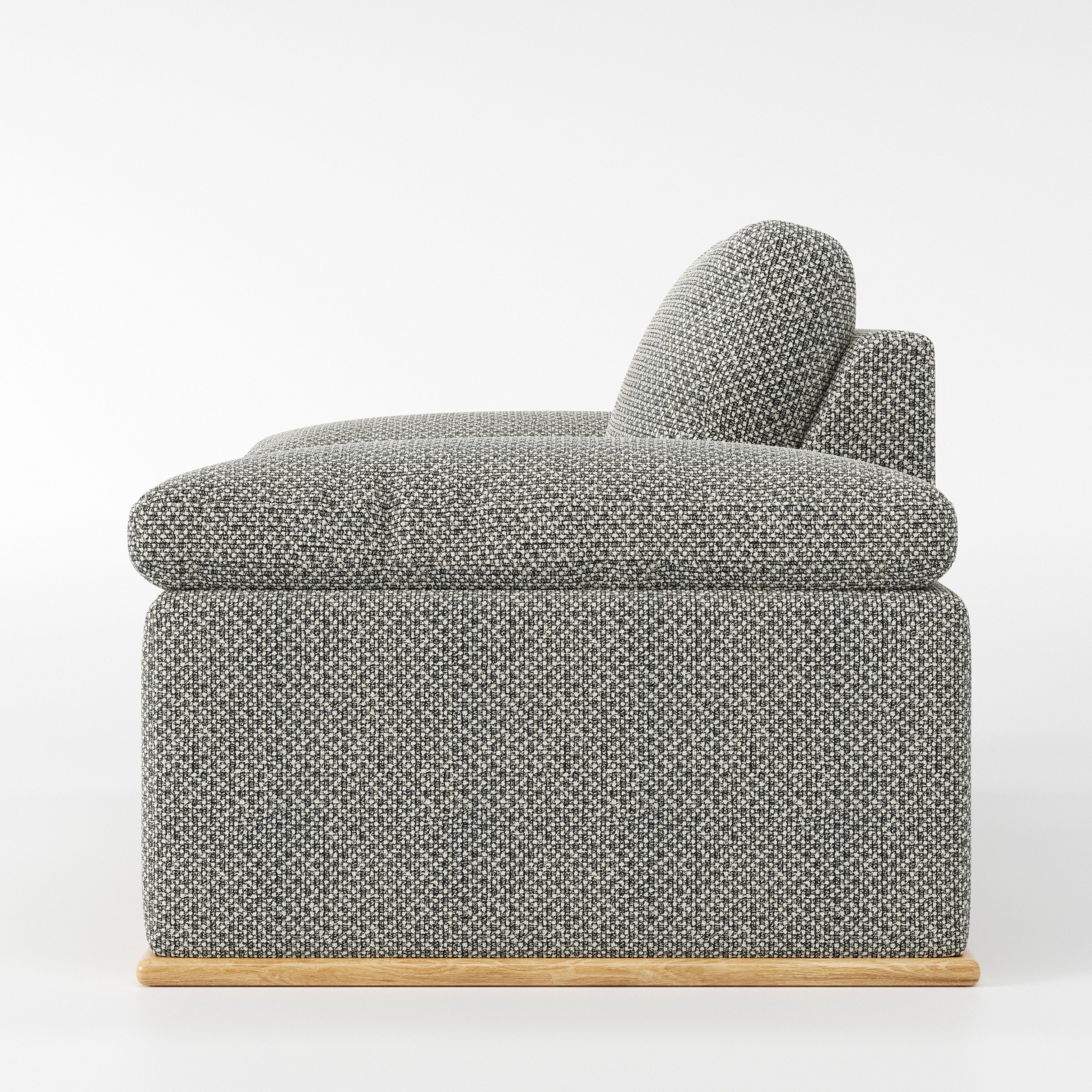 Cusher armchair in Rousay Wool Blend Tar and Chalk shown in side profile displaying proportions and overall silhouette.