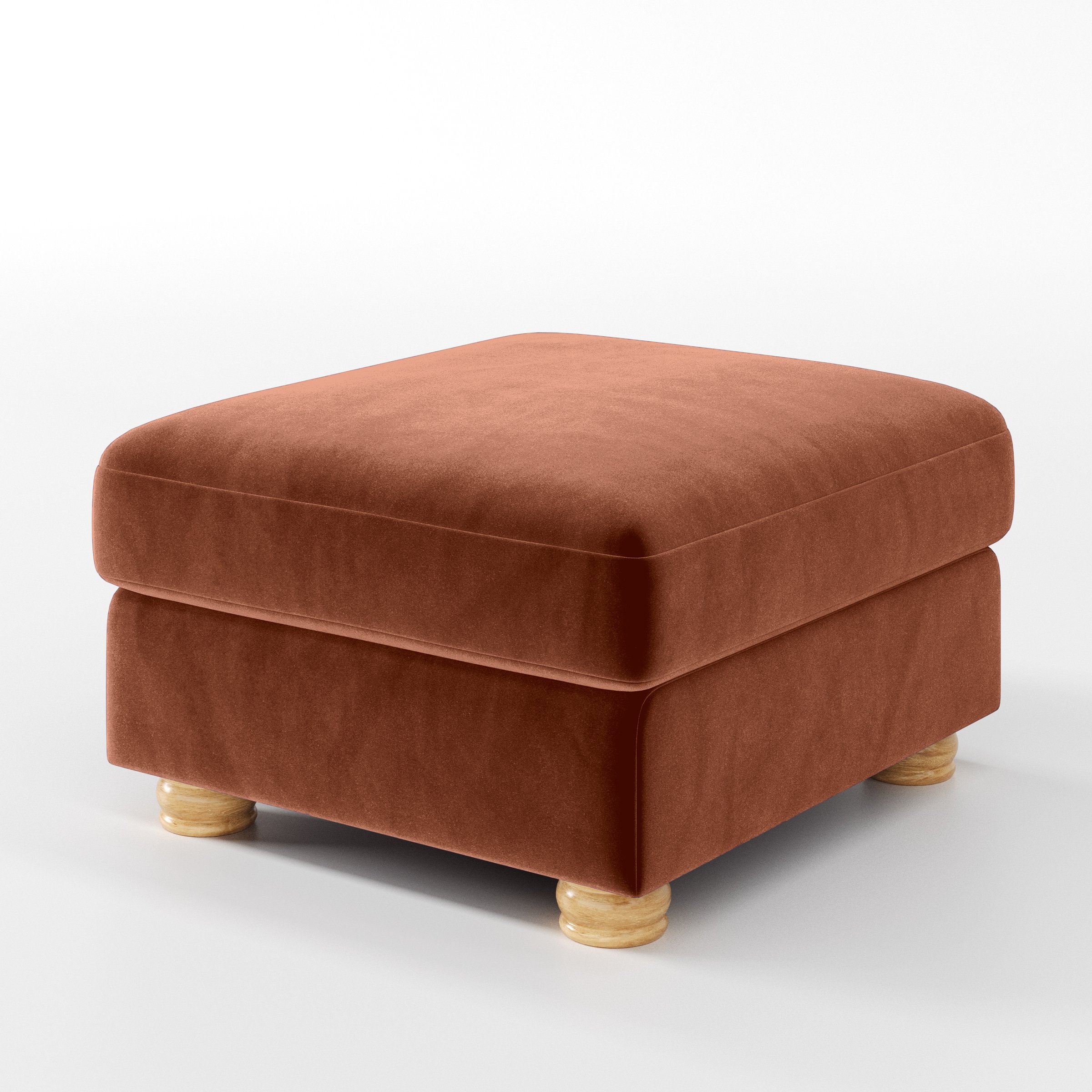 Diagonal view of the Anna Lee footstool upholstered in Plush EasyClean Velvet in Apricot.