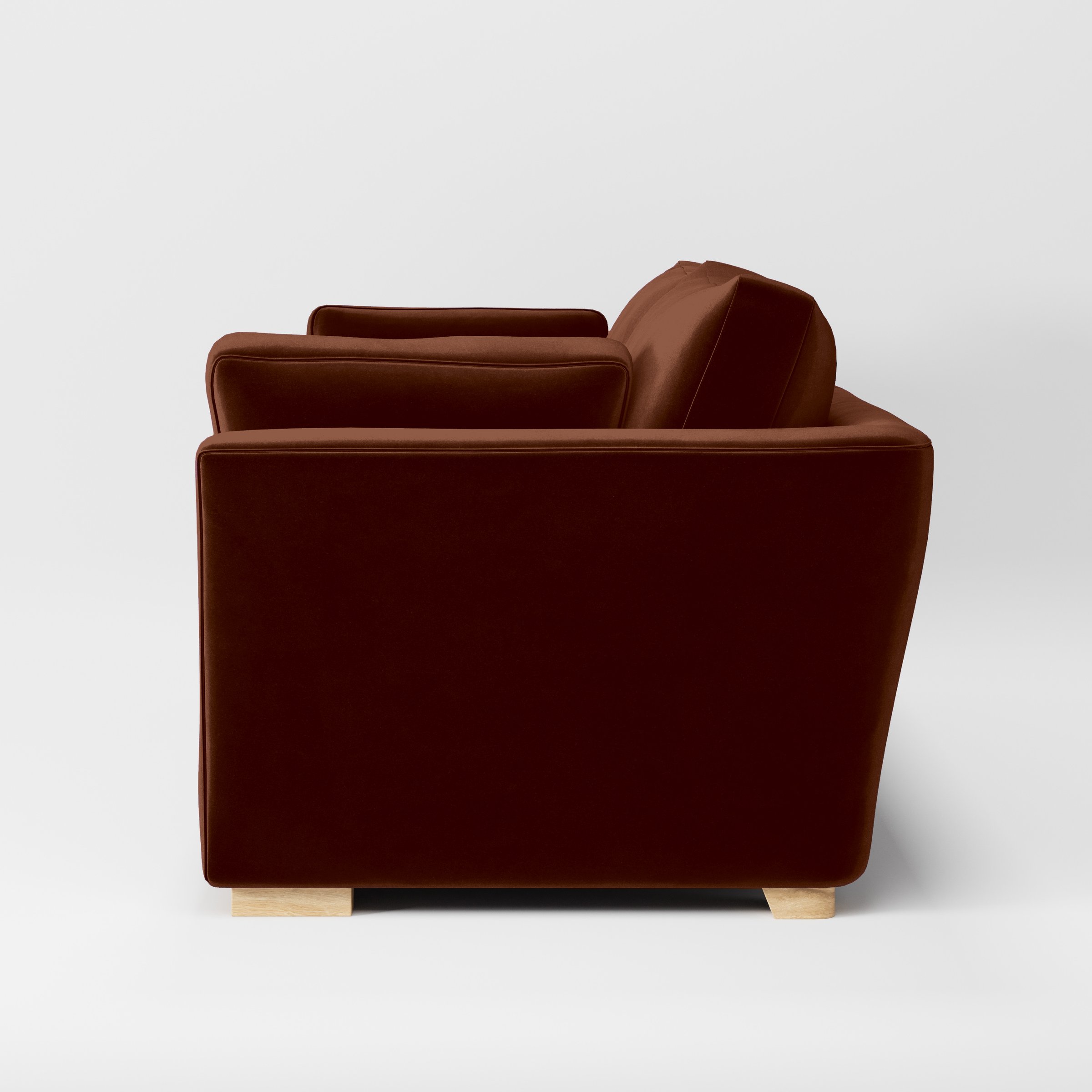 Side view of the Stowe sofa upholstered in Plush EasyClean Velvet in Maple.