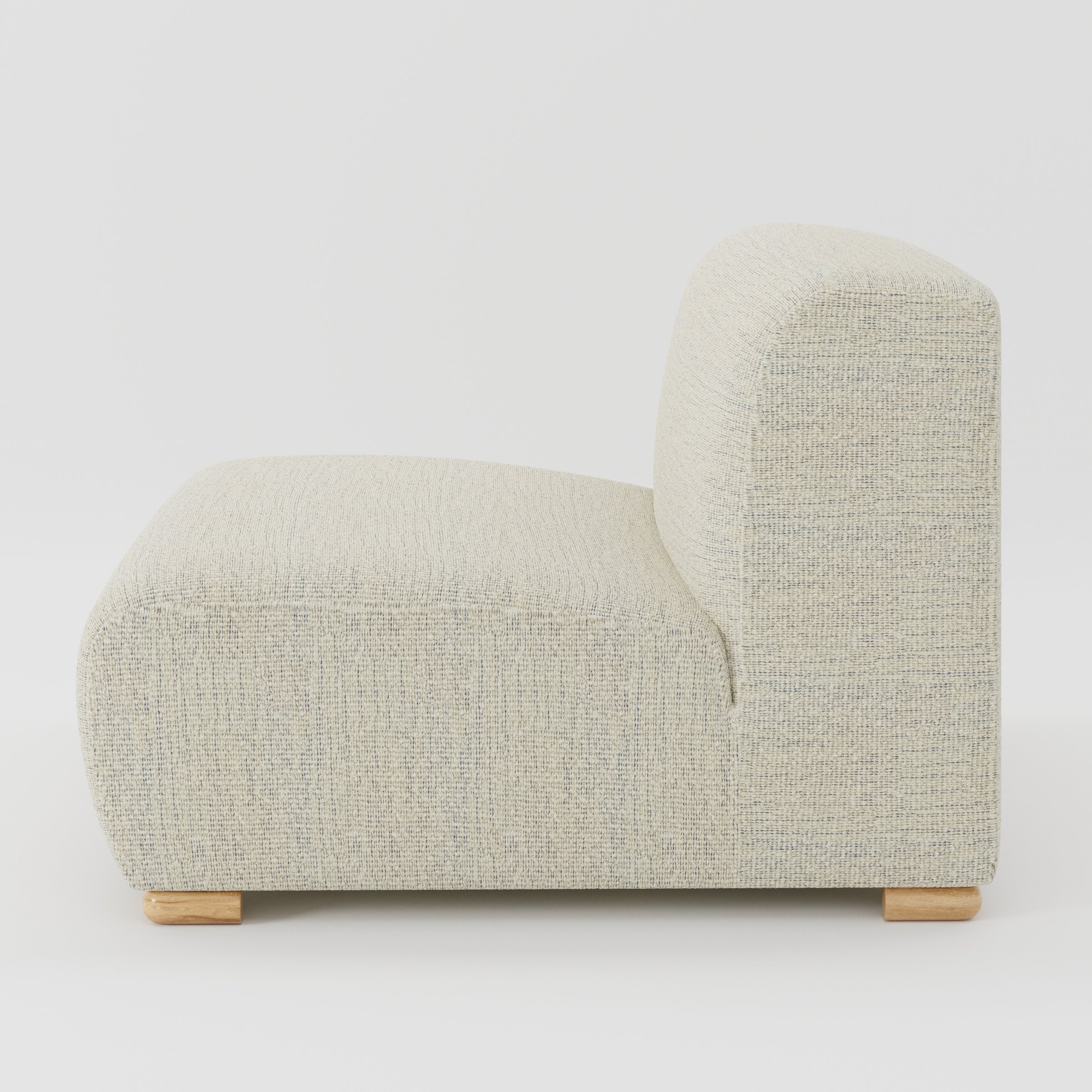 Tay single sofa unit in Orsay Bouclé Cream and Marine shown from the side showing the low backrest, deep seat and timber feet.