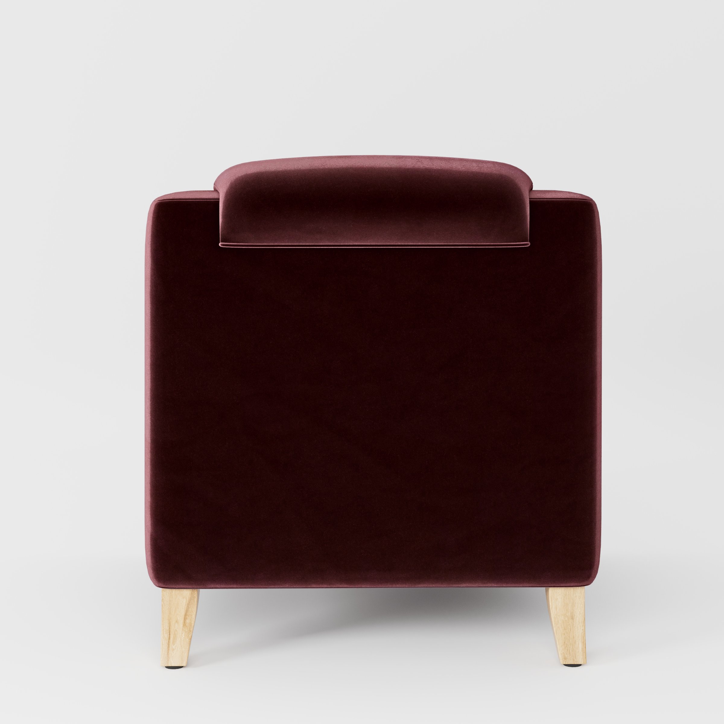 Rear view of the Erne armchair upholstered in Plush EasyClean Velvet in Ruby.