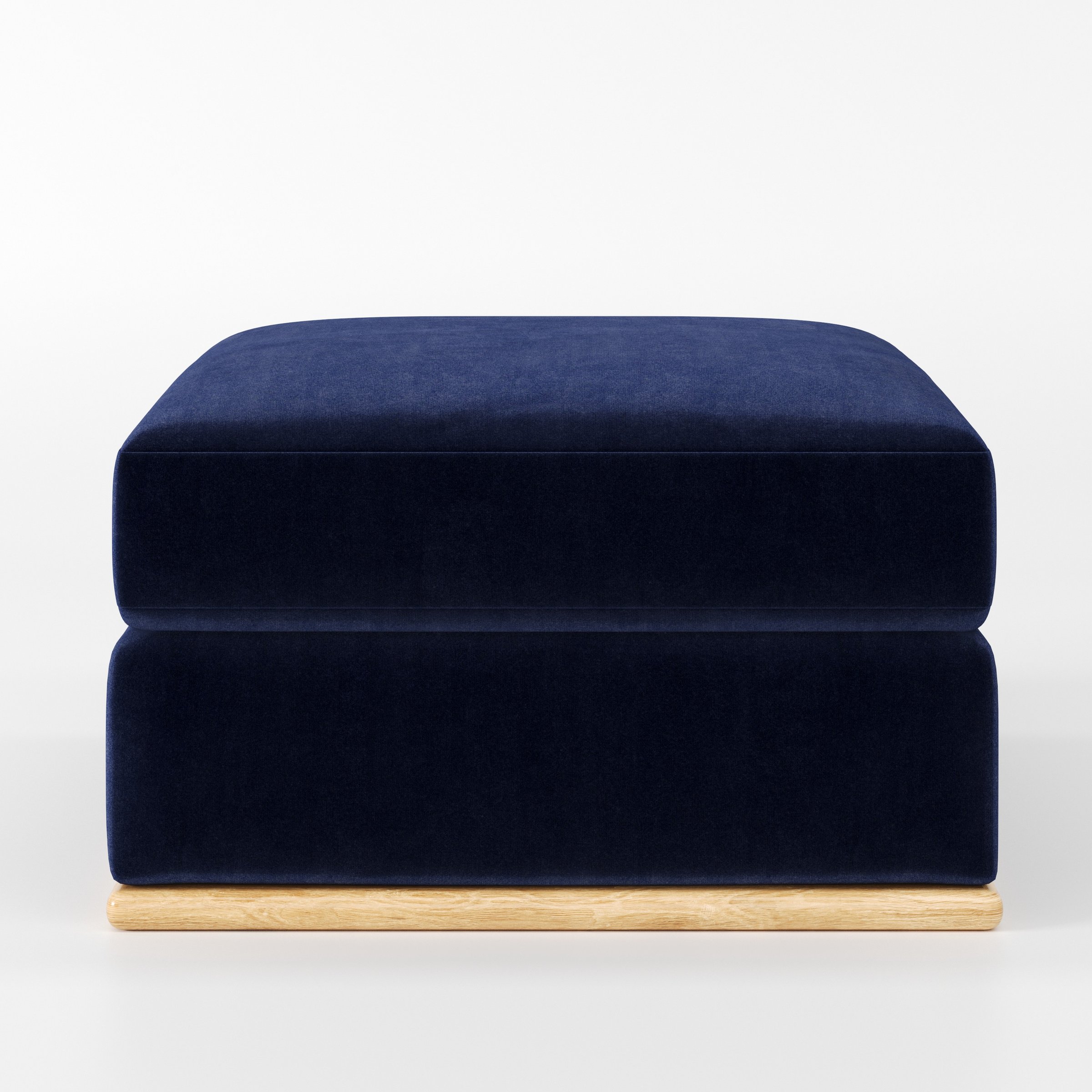 Cusher footstool in Noss Velvet Navy shown front-on against a neutral studio backdrop.