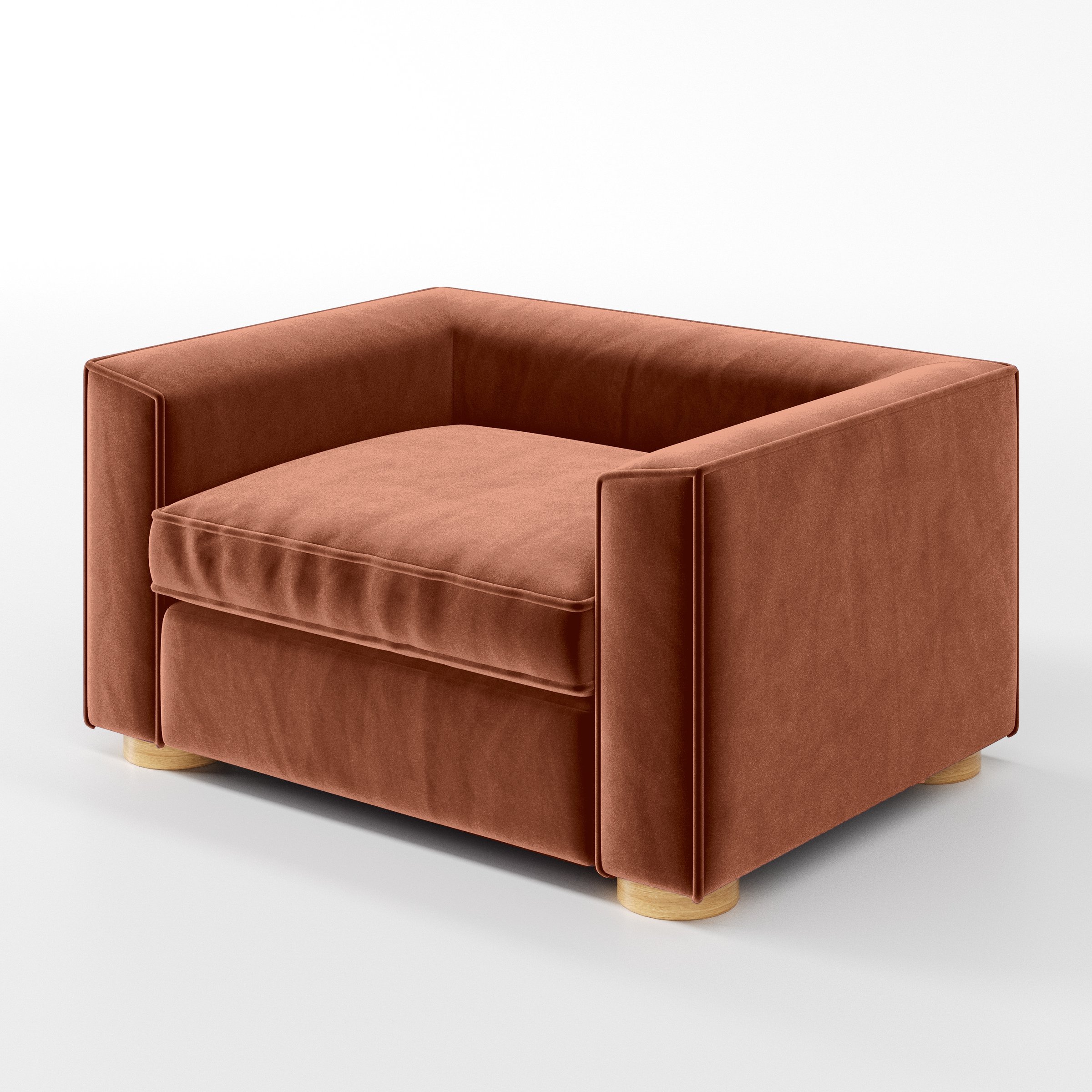 Diagonal view of the Feale armchair upholstered in Plush EasyClean Velvet in Apricot.