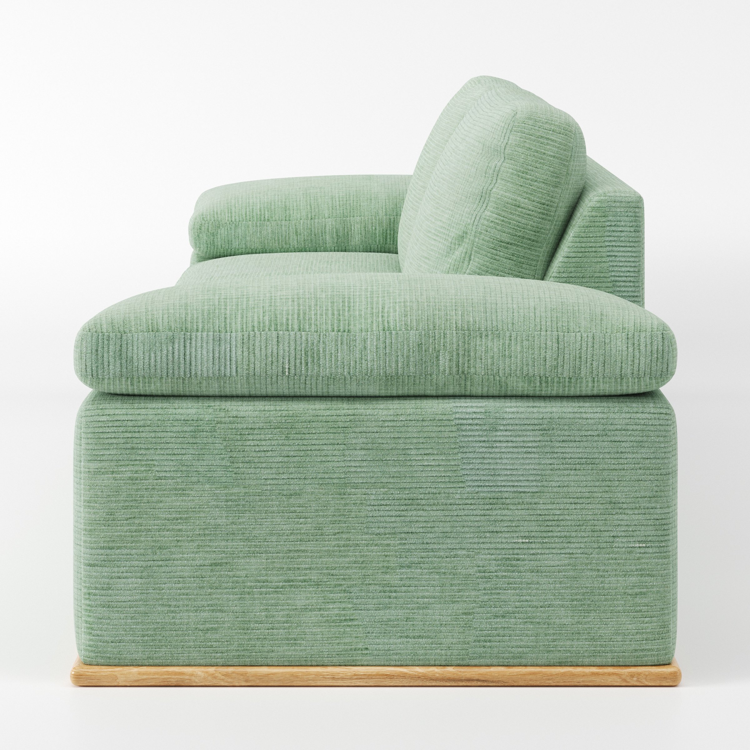 Cusher sofa in Caldey Velvet Corduroy Eucalyptus shown in side profile displaying proportions and overall silhouette.