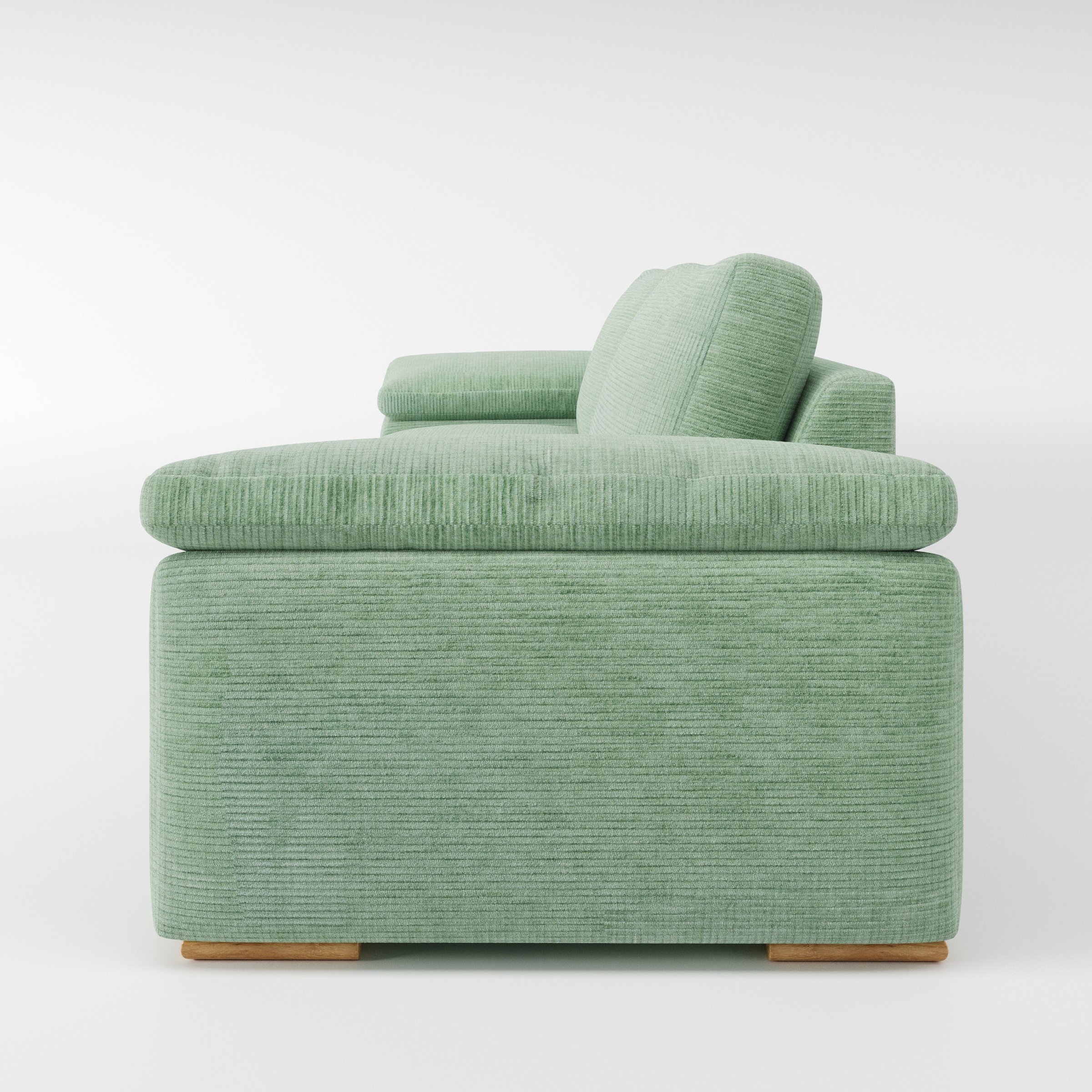 Moy sofa in Caldey Velvet Corduroy Eucalyptus shown in side profile displaying proportions and overall silhouette.