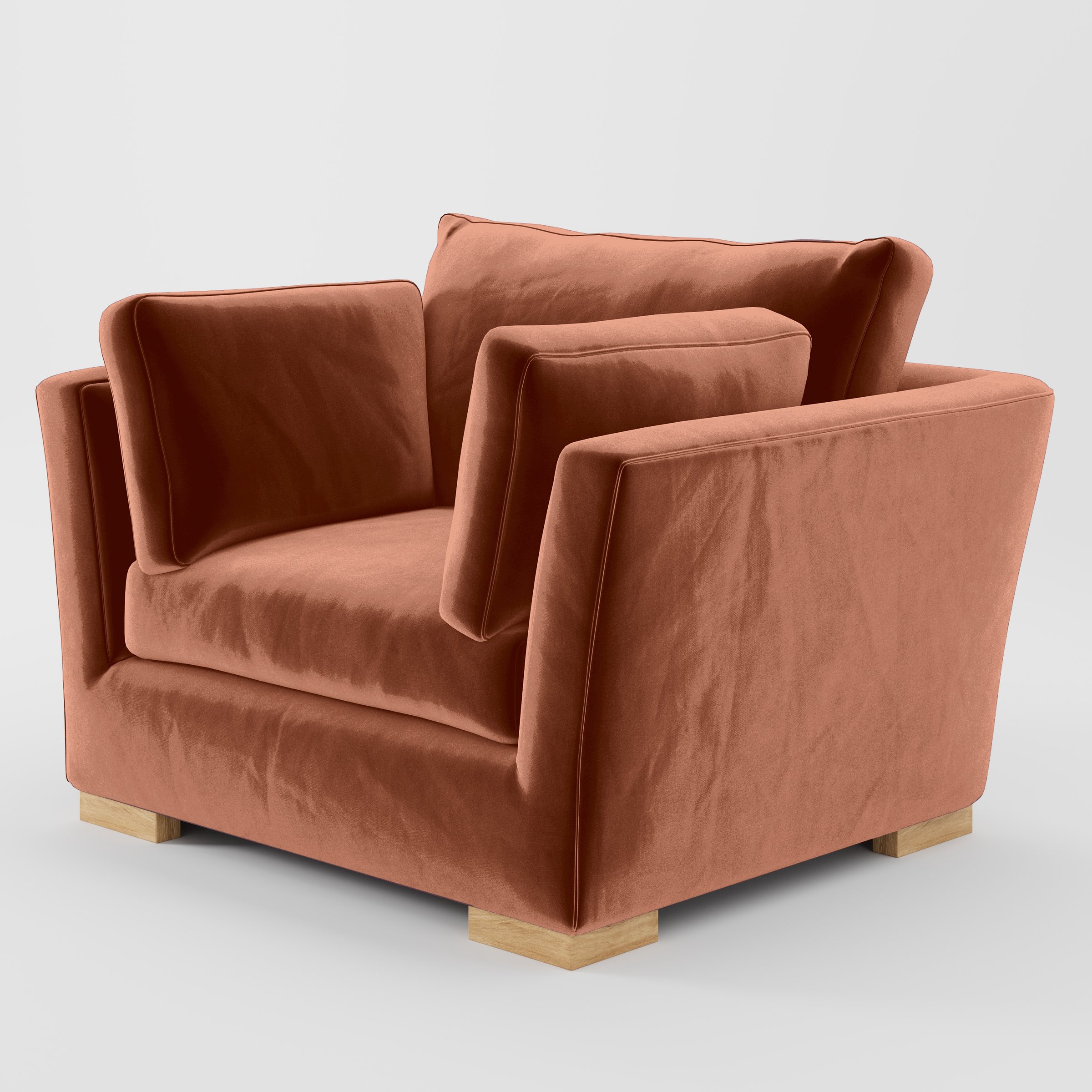 Diagonal view of the Stowe armchair upholstered in Plush EasyClean Velvet in Apricot.