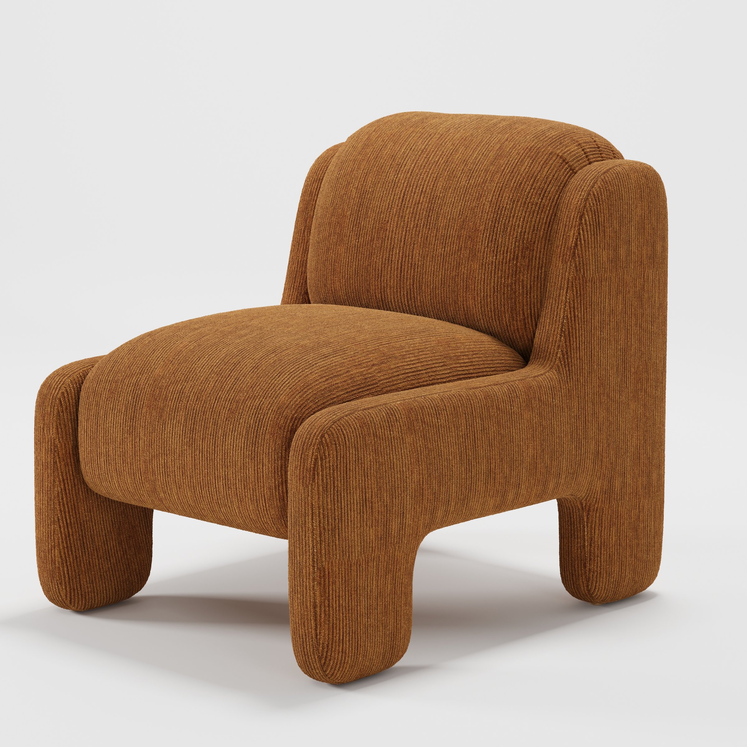 Inny armchair in Caldey Velvet Corduroy Tobacco shown at a diagonal angle highlighting sculpted form and low seat.