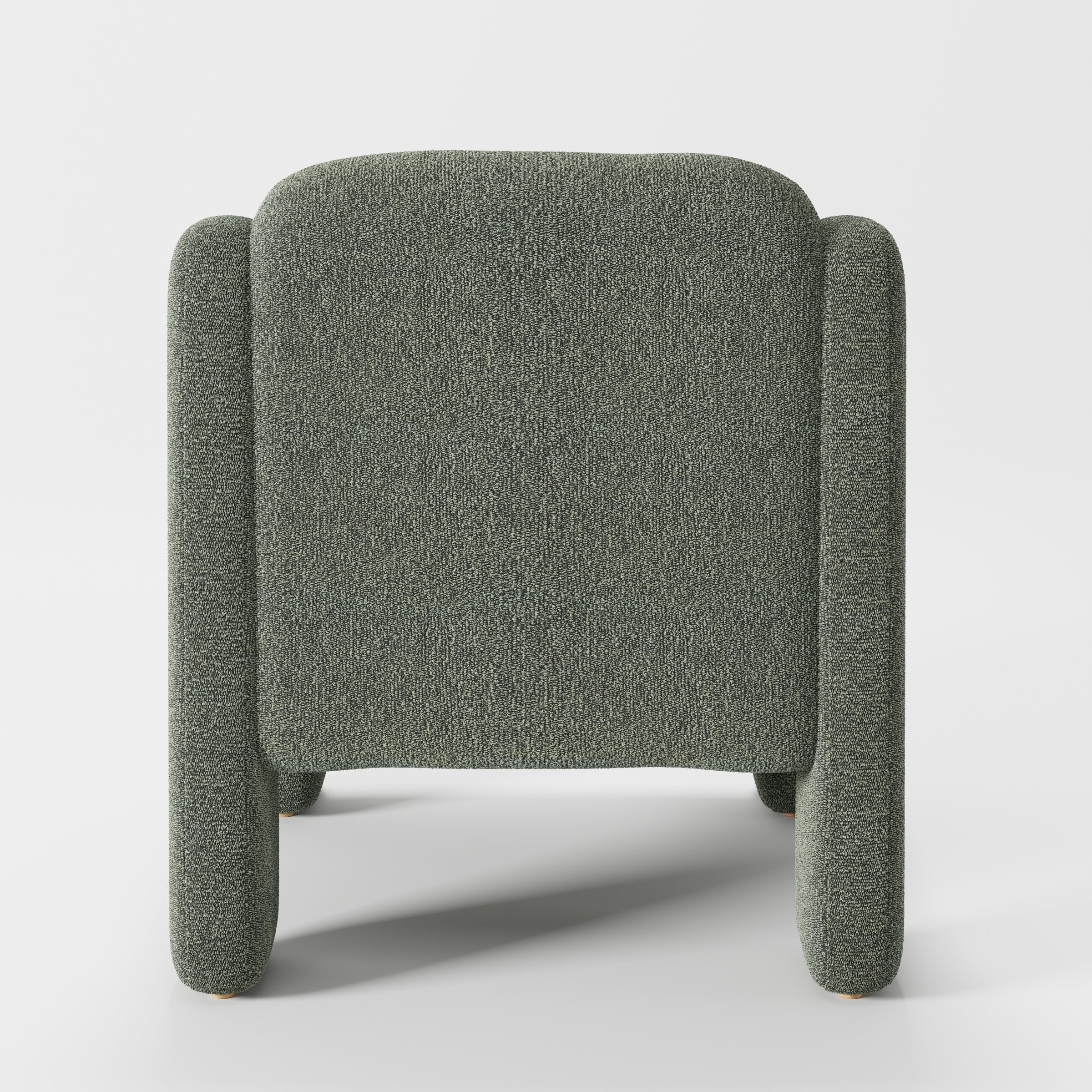 Inny armchair in Kilda Boucle Moss shown from the rear highlighting curved backrest and upholstery finish.