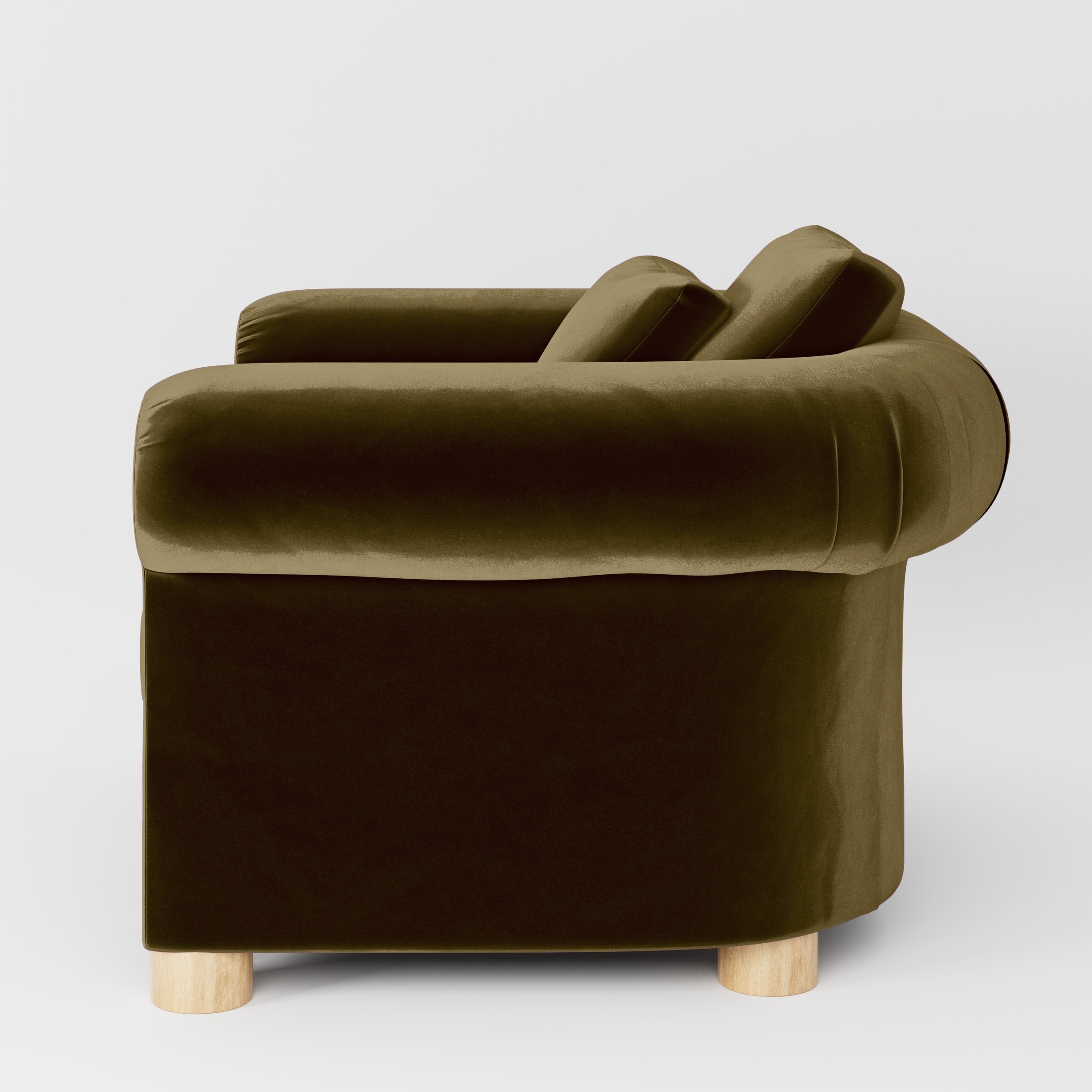 Side view of the Windermere armchair upholstered in Plush EasyClean Velvet in Cedar.