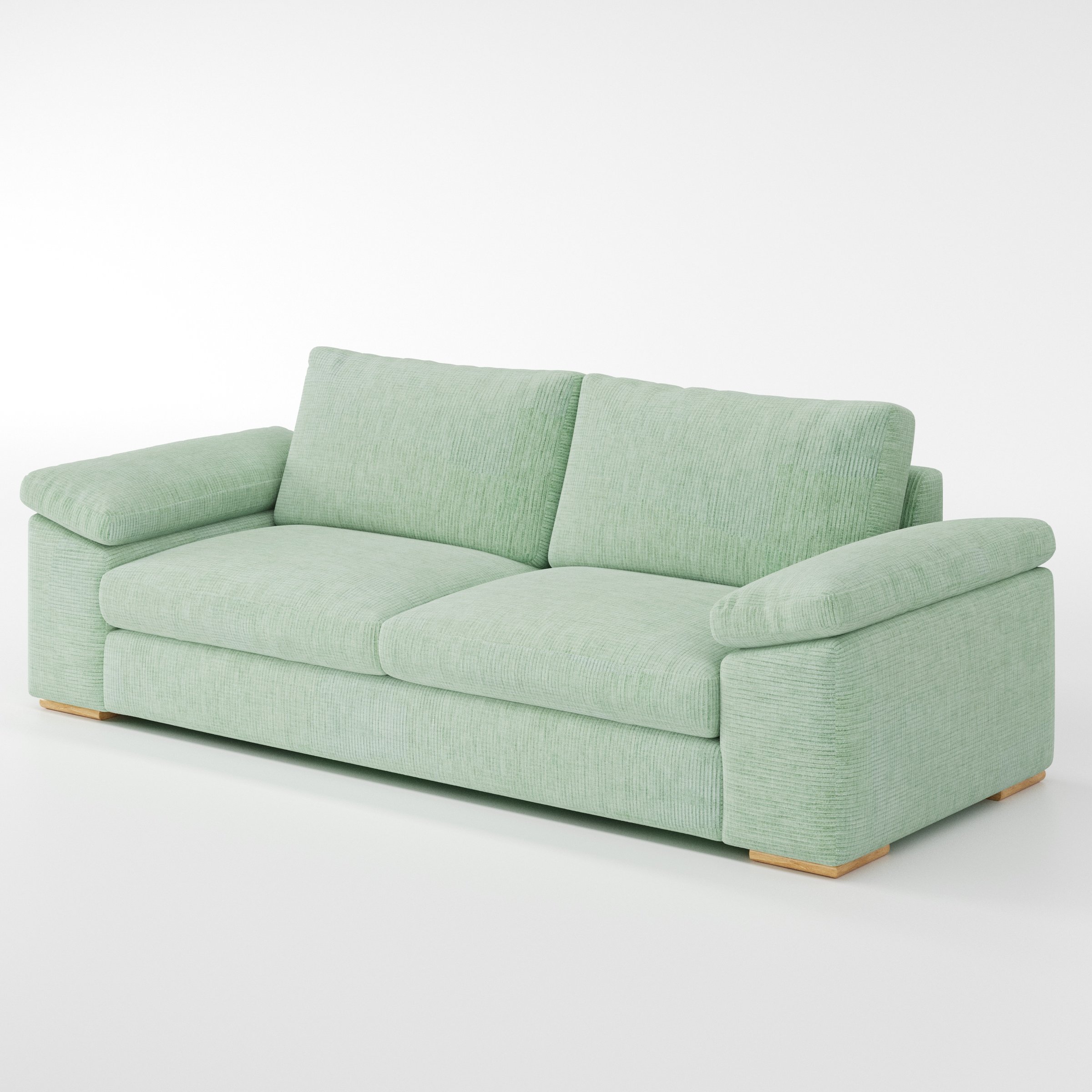Moy sofa in Caldey Velvet Corduroy Eucalyptus shown at a diagonal angle highlighting arm profile and seat depth.