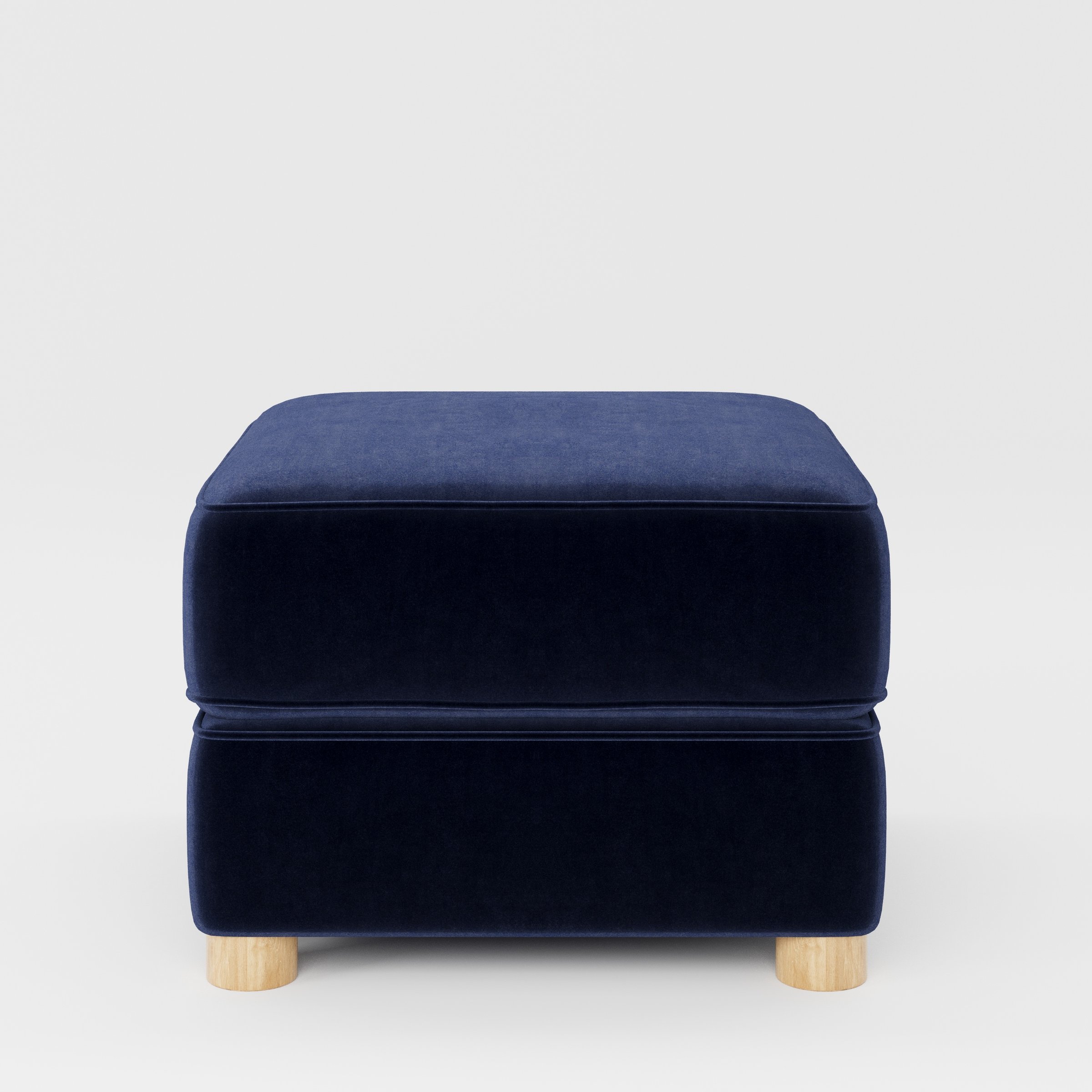 Fergus footstool in Noss Velvet Navy shown front-on against a neutral studio backdrop.