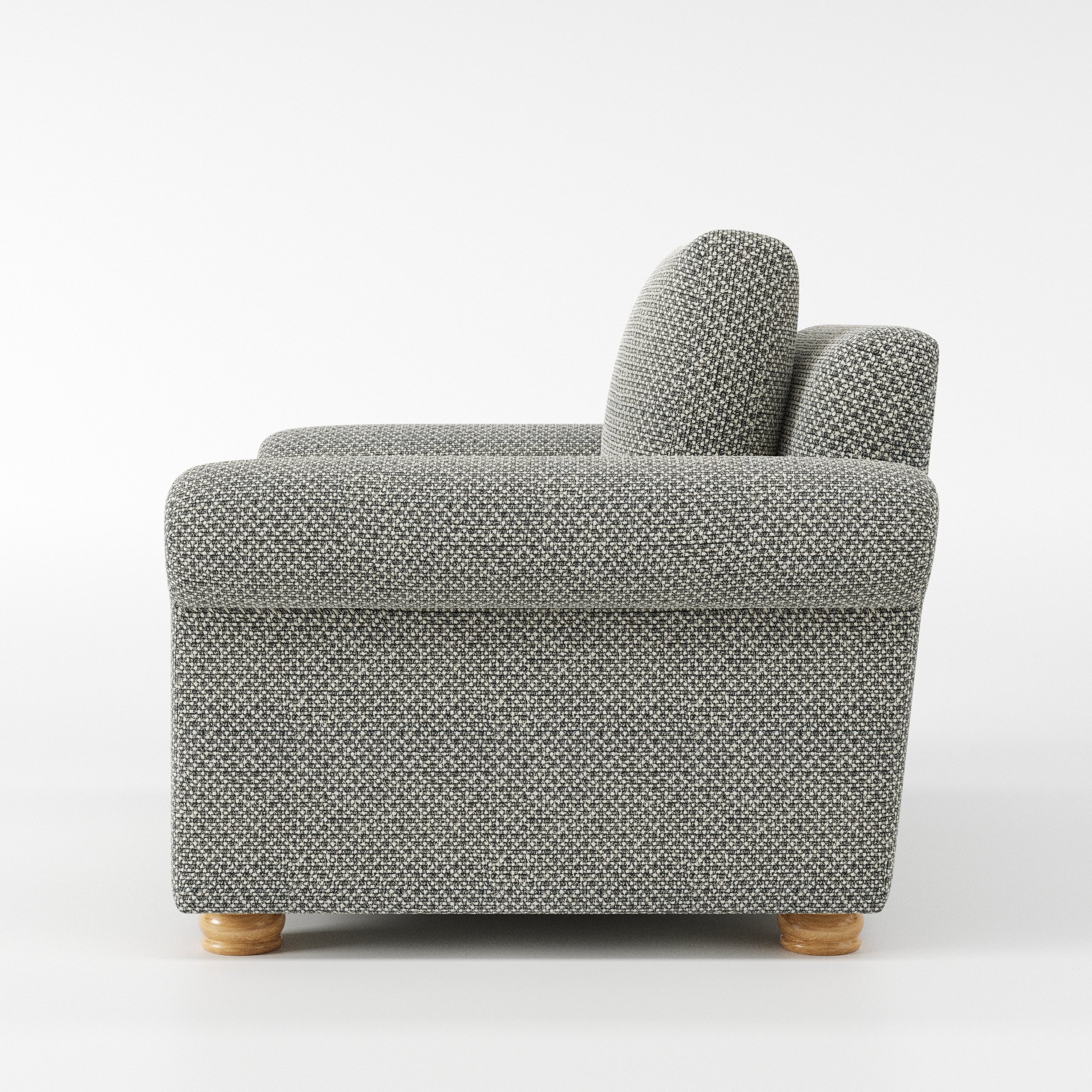 Anna Lee armchair in Rousay Wool Blend Tar and Chalk shown in side profile displaying proportions and overall silhouette.