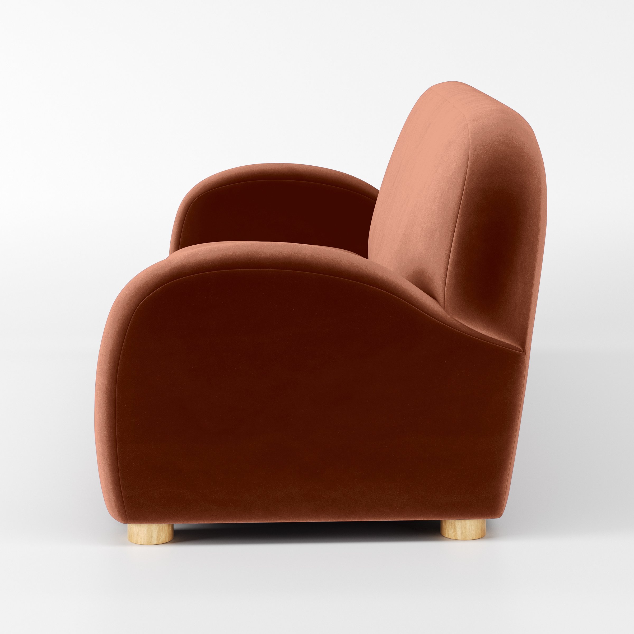 Side view of the Awe sofa upholstered in Plush EasyClean Velvet in Apricot.